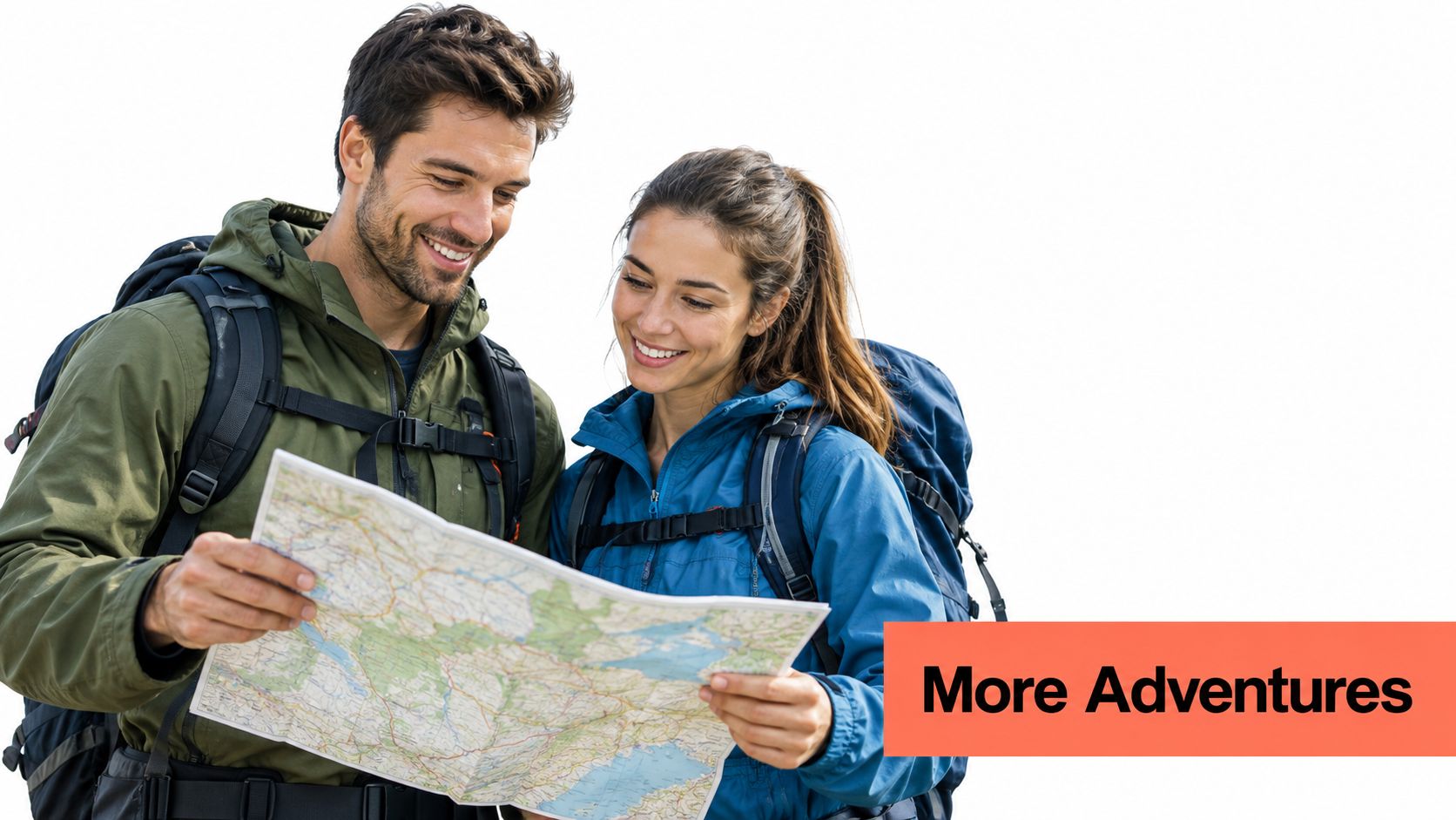 A happy couple of hikers looking at a paper map while planning their next outdoor adventure together.