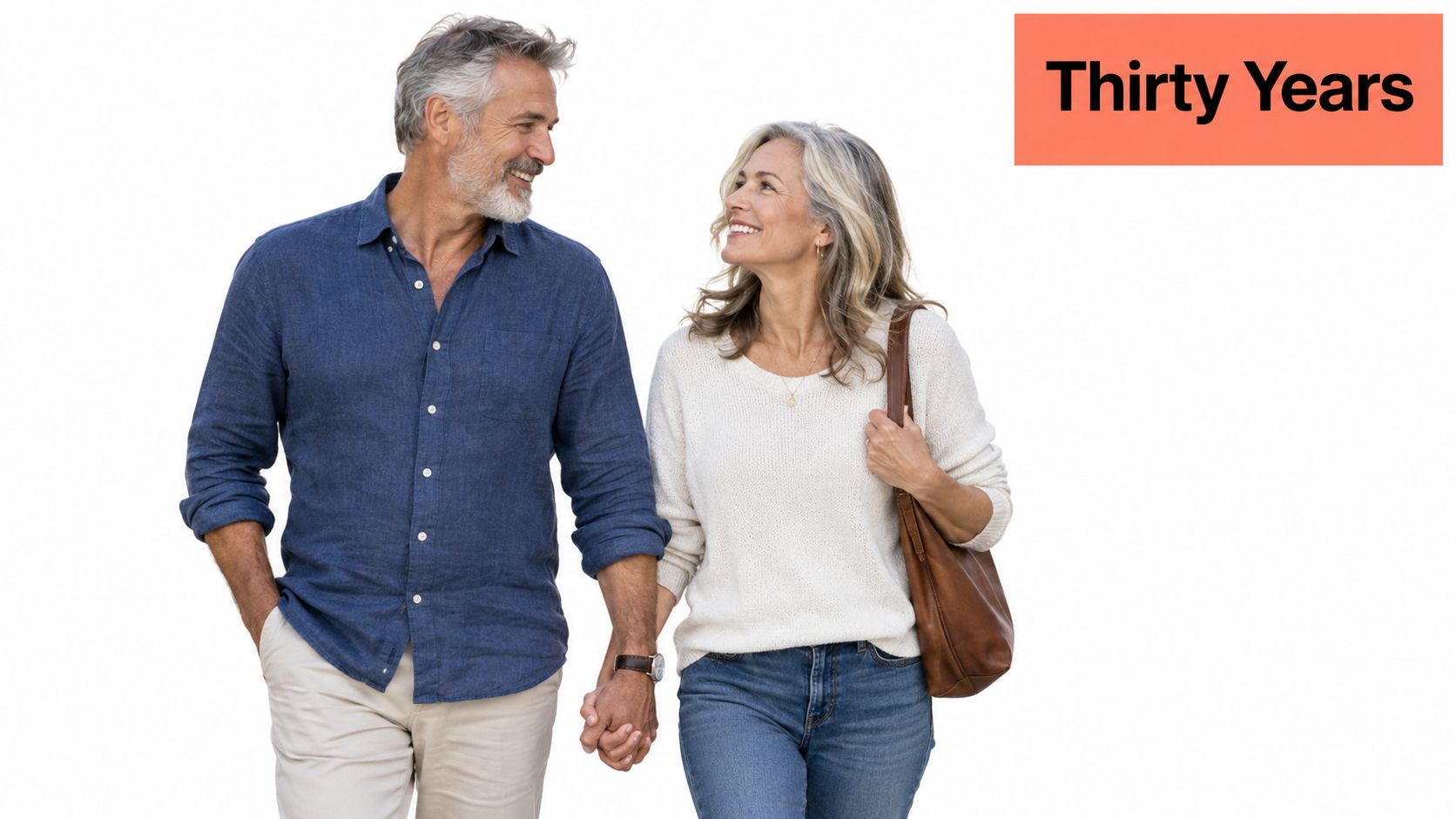 A happy senior couple holding hands and walking together, representing a long-lasting marriage and anniversary.