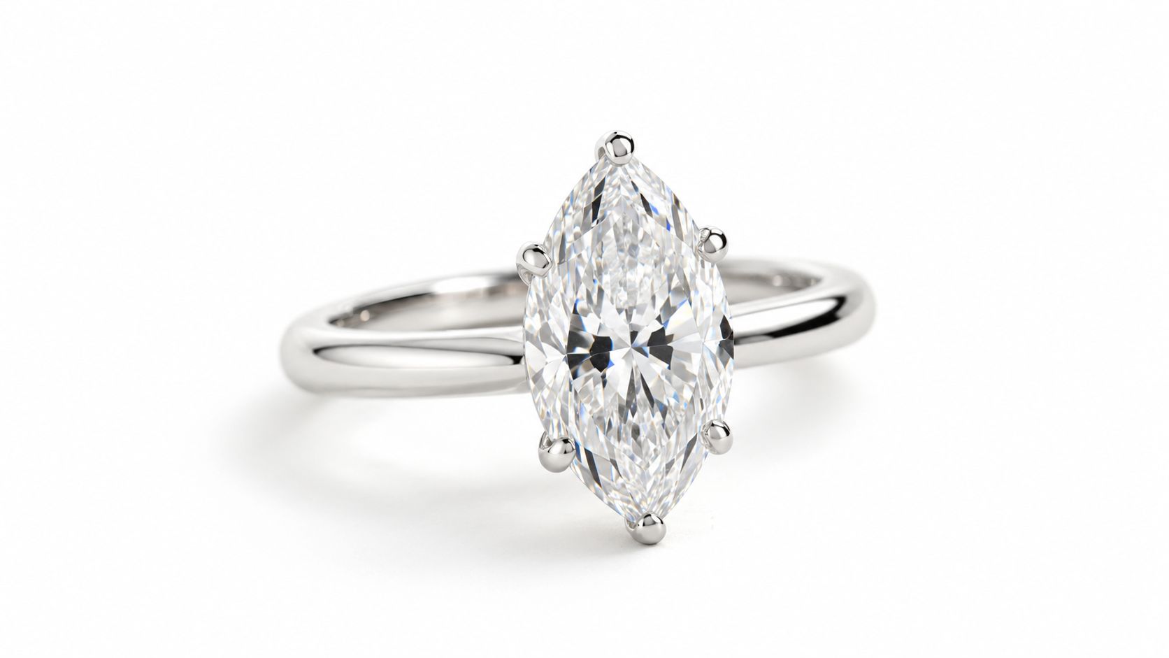 A sophisticated marquise cut diamond engagement ring set in a polished platinum or white gold band.