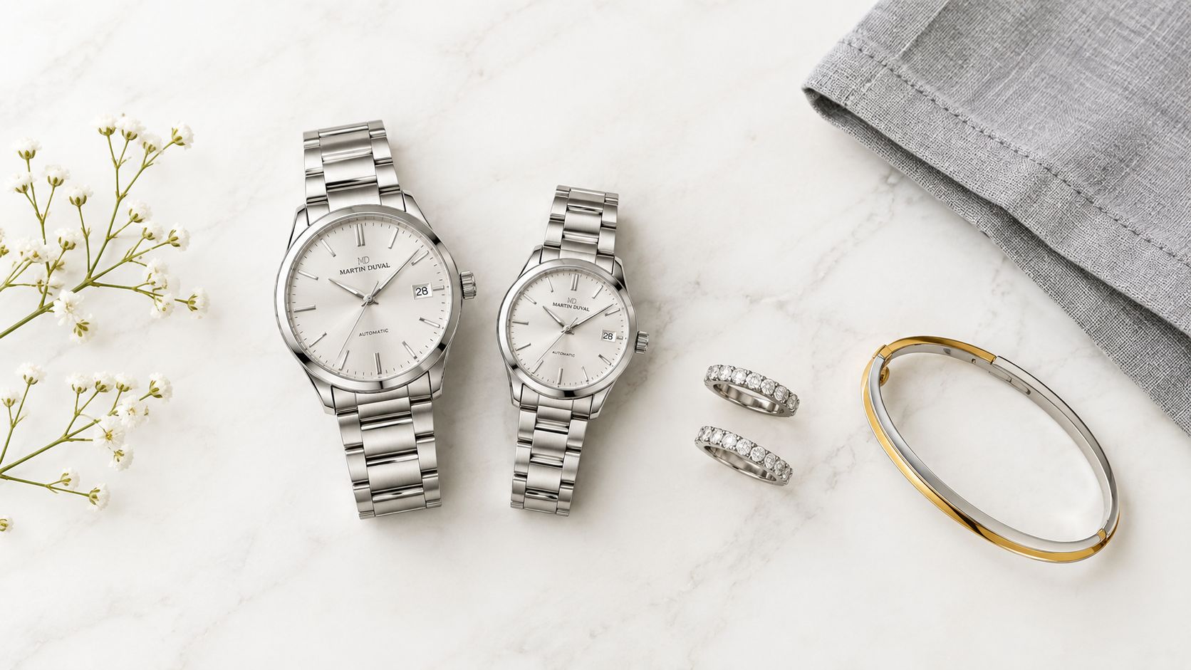 A luxury 25th wedding anniversary gift set featuring two silver watches, diamond rings, and a golden bracelet.