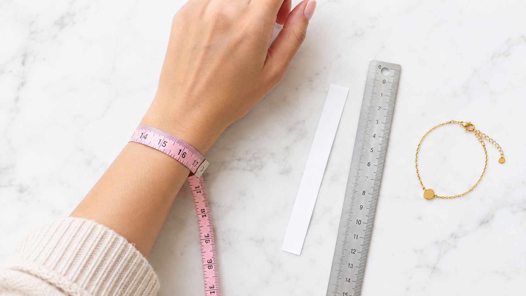 A person measuring their wrist with a pink measuring tape next to a ruler and bracelet.