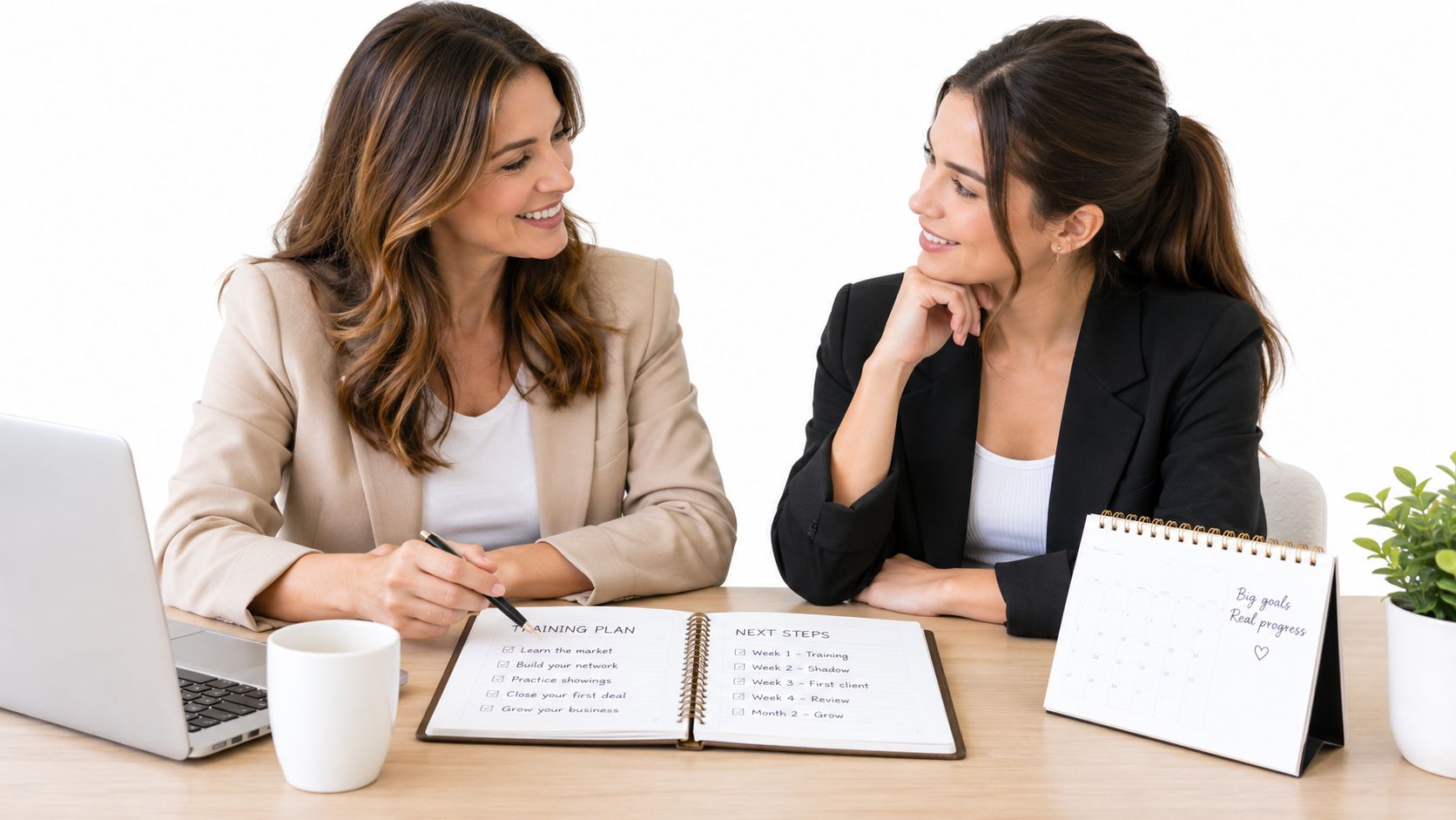 A professional real estate mentor guiding a mentee through a training plan at an office desk.
