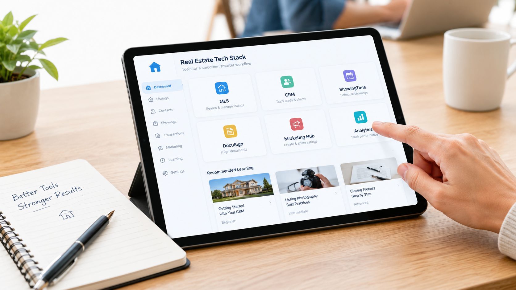 A person using a tablet to access a real estate tech dashboard for managing property business tasks.