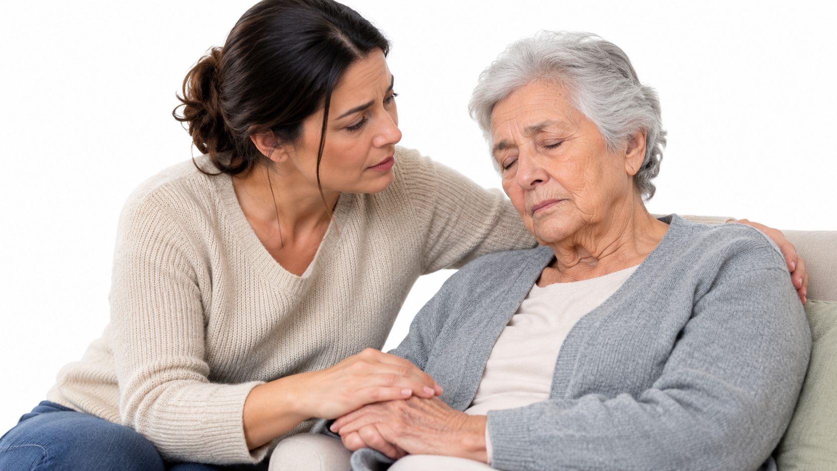 A caring woman comforting her elderly mother, who is resting with her eyes closed on a couch.