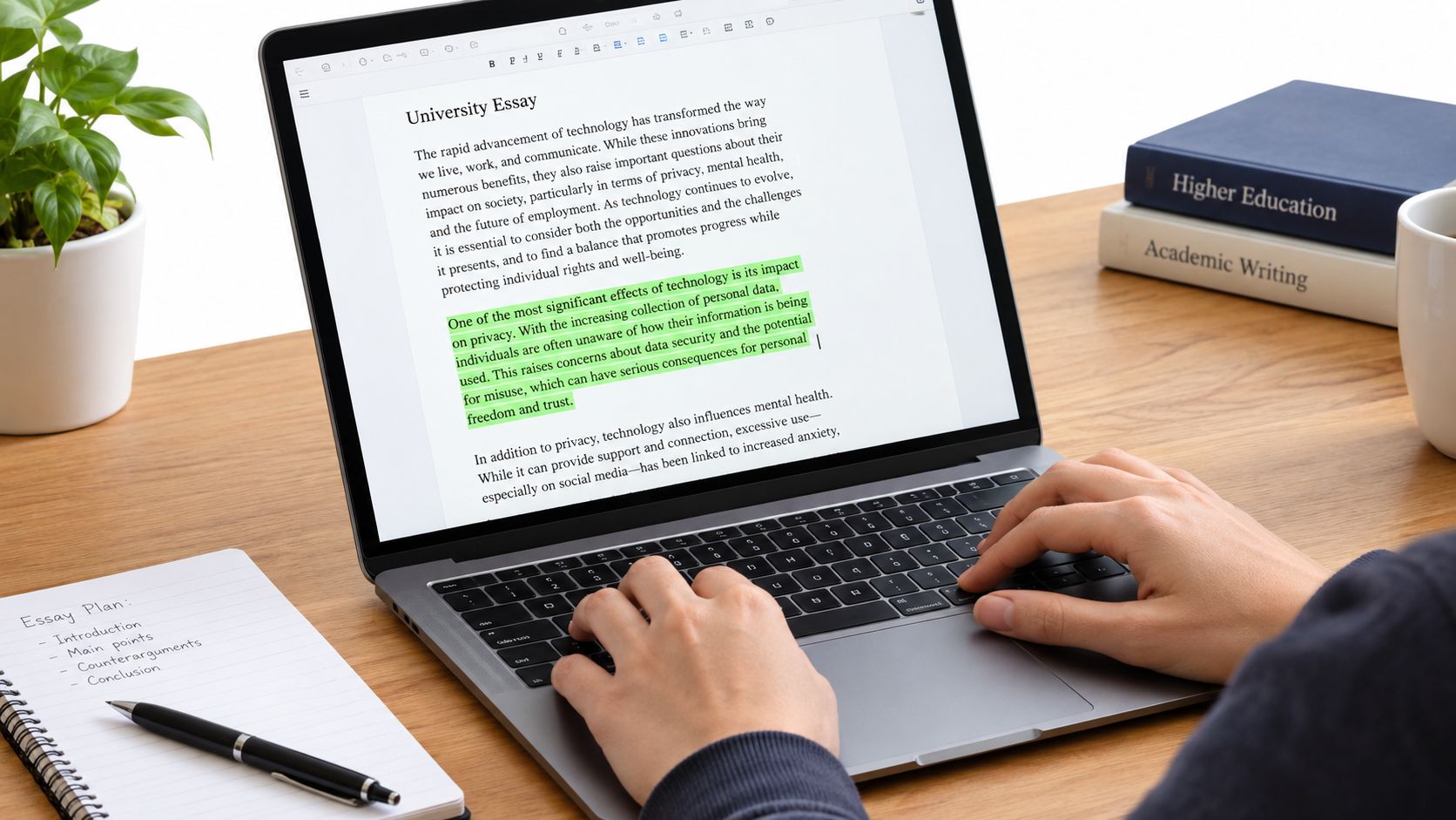 A student's hands editing an essay on a laptop, highlighting a paragraph to adjust the word count.