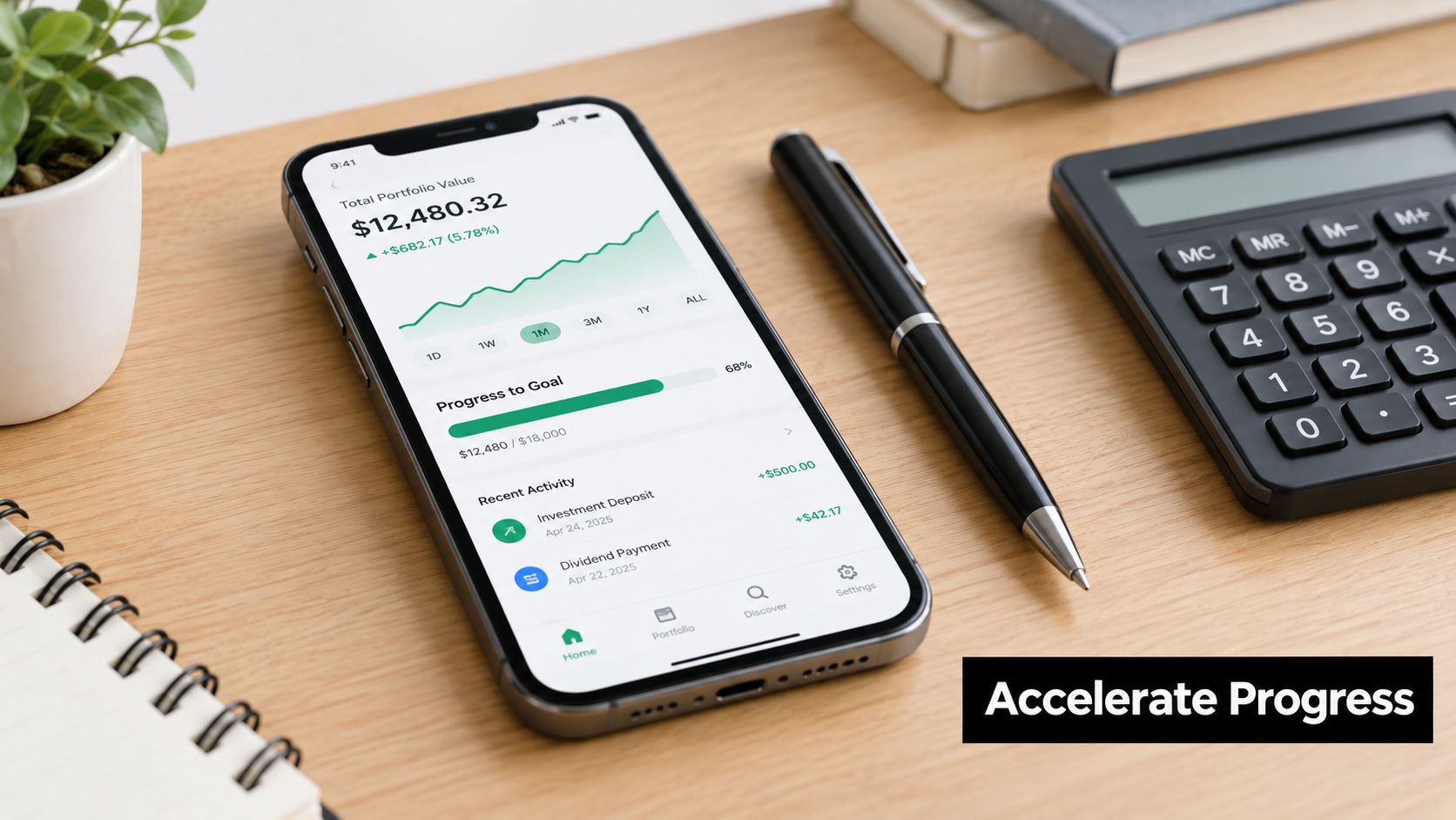 A smartphone screen displaying a personal investment portfolio app on a wooden desk next to a calculator.