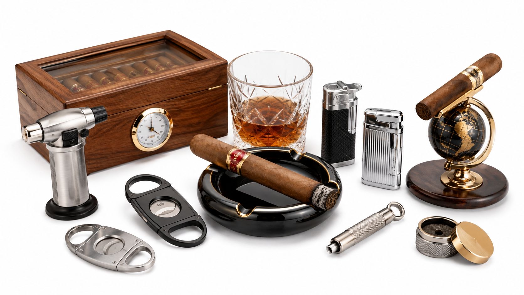 A luxurious collection of cigar accessories including a humidor, ashtray, cutters, lighters, and a whiskey glass.