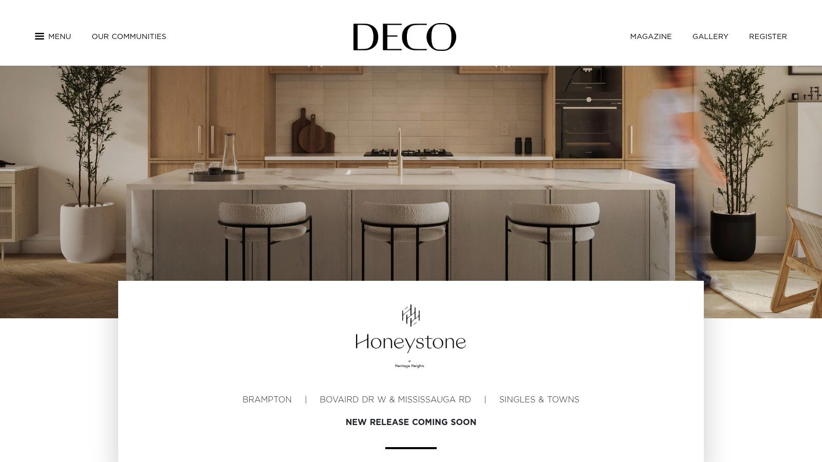 A bright, modern kitchen in a new home build with white cabinets, a large island, and high-end finishes, representing the interior quality offered by DECO Homes.