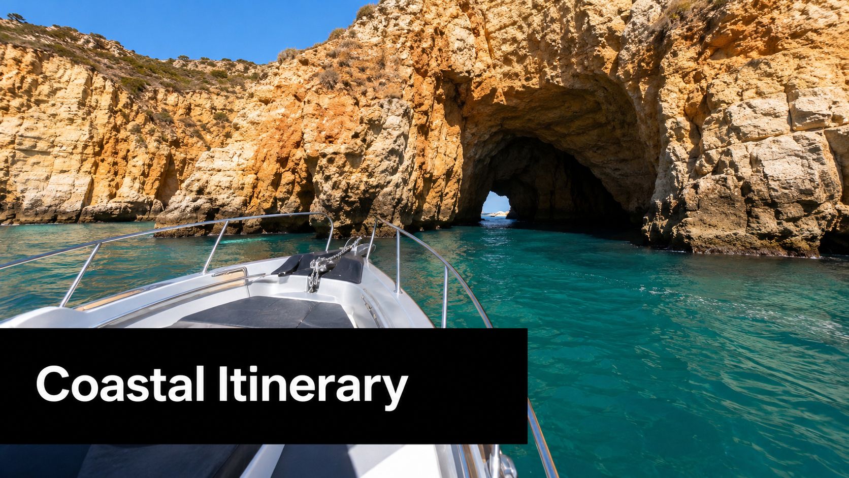 A boat cruising through turquoise waters toward a large sea cave on the Algarve coast of Portugal.