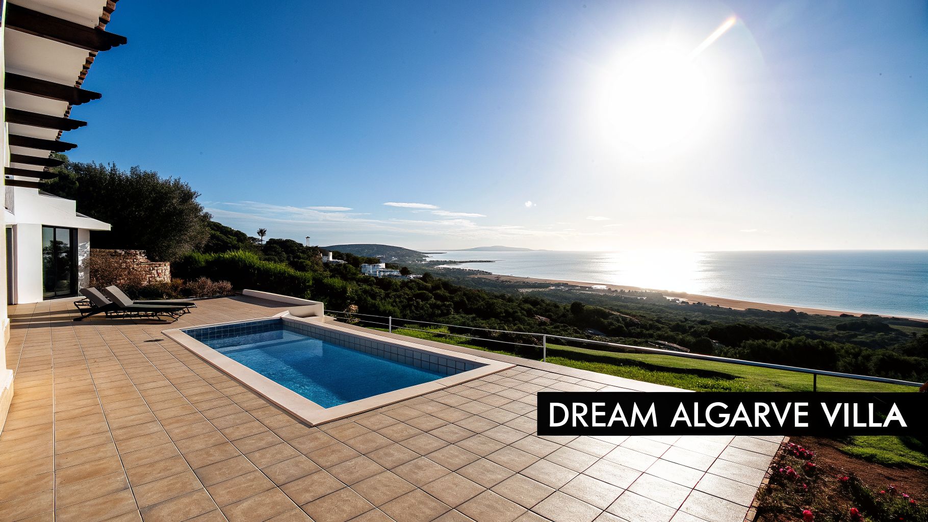 A luxurious Algarve villa terrace with a swimming pool, sun loungers, and stunning sea views.