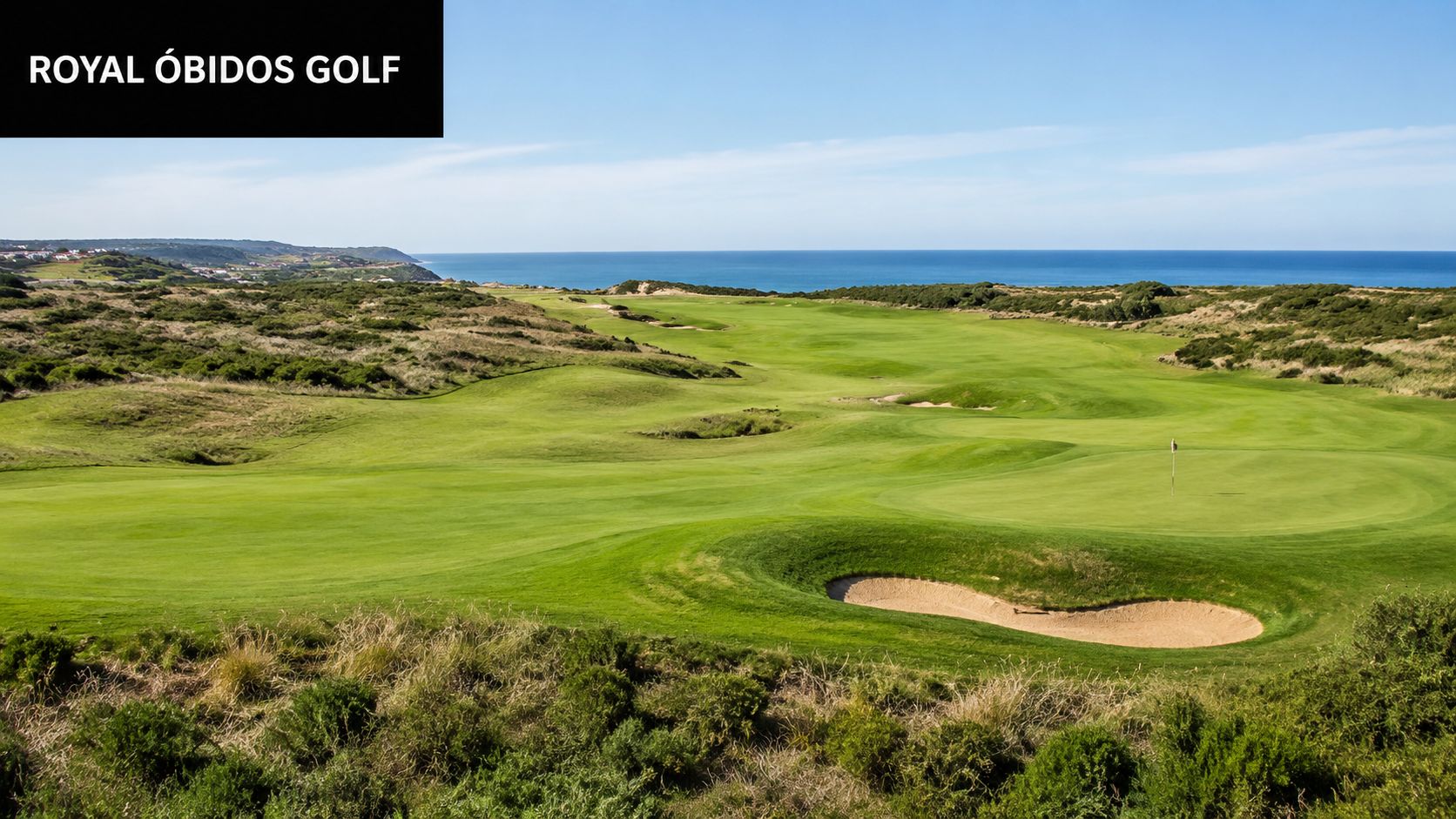 A wide, scenic view of the Royal Óbidos golf course featuring a sandy bunker and ocean views.