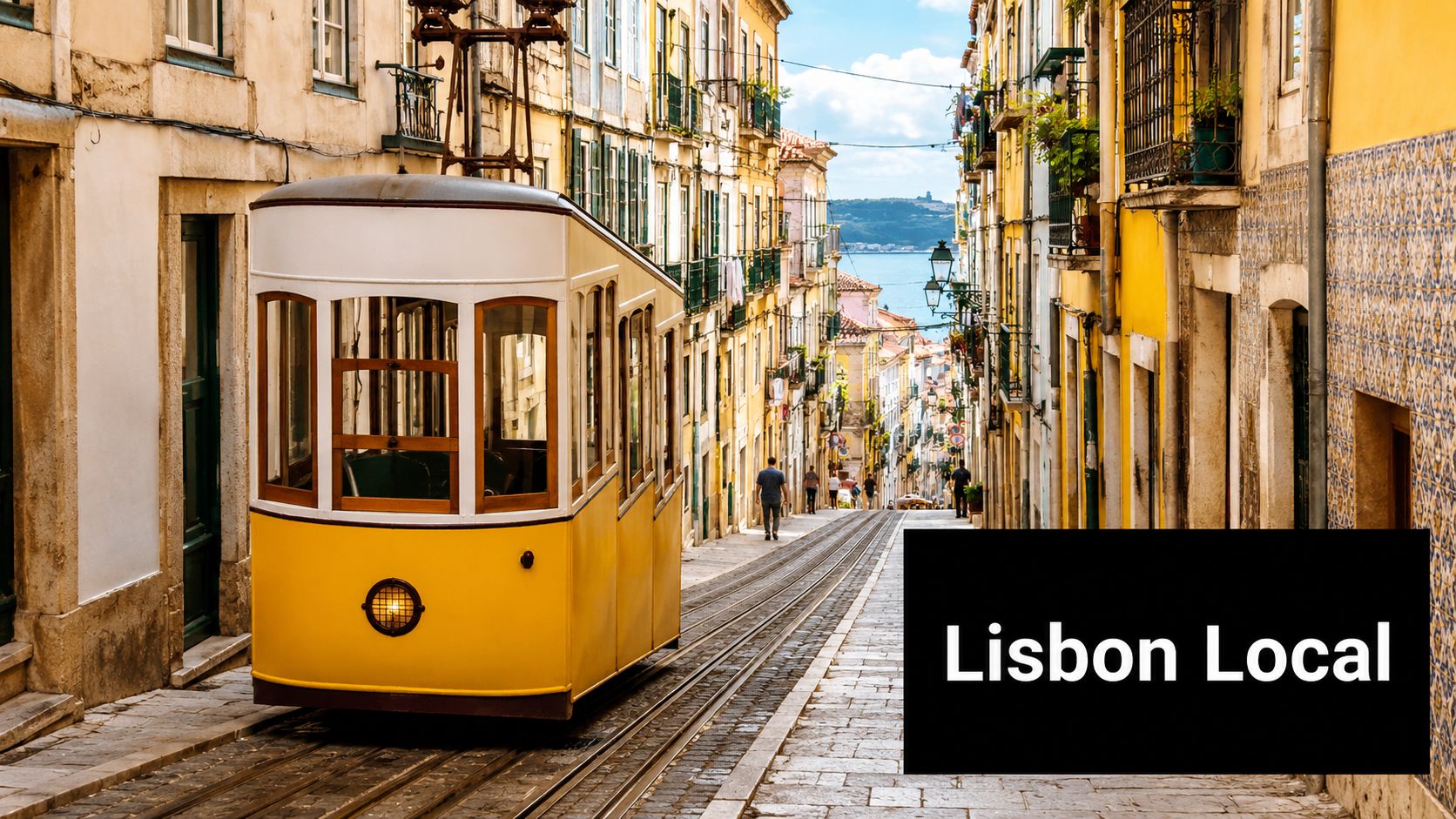 A iconic yellow funicular tram traveling down a steep, narrow street in the historic city of Lisbon.