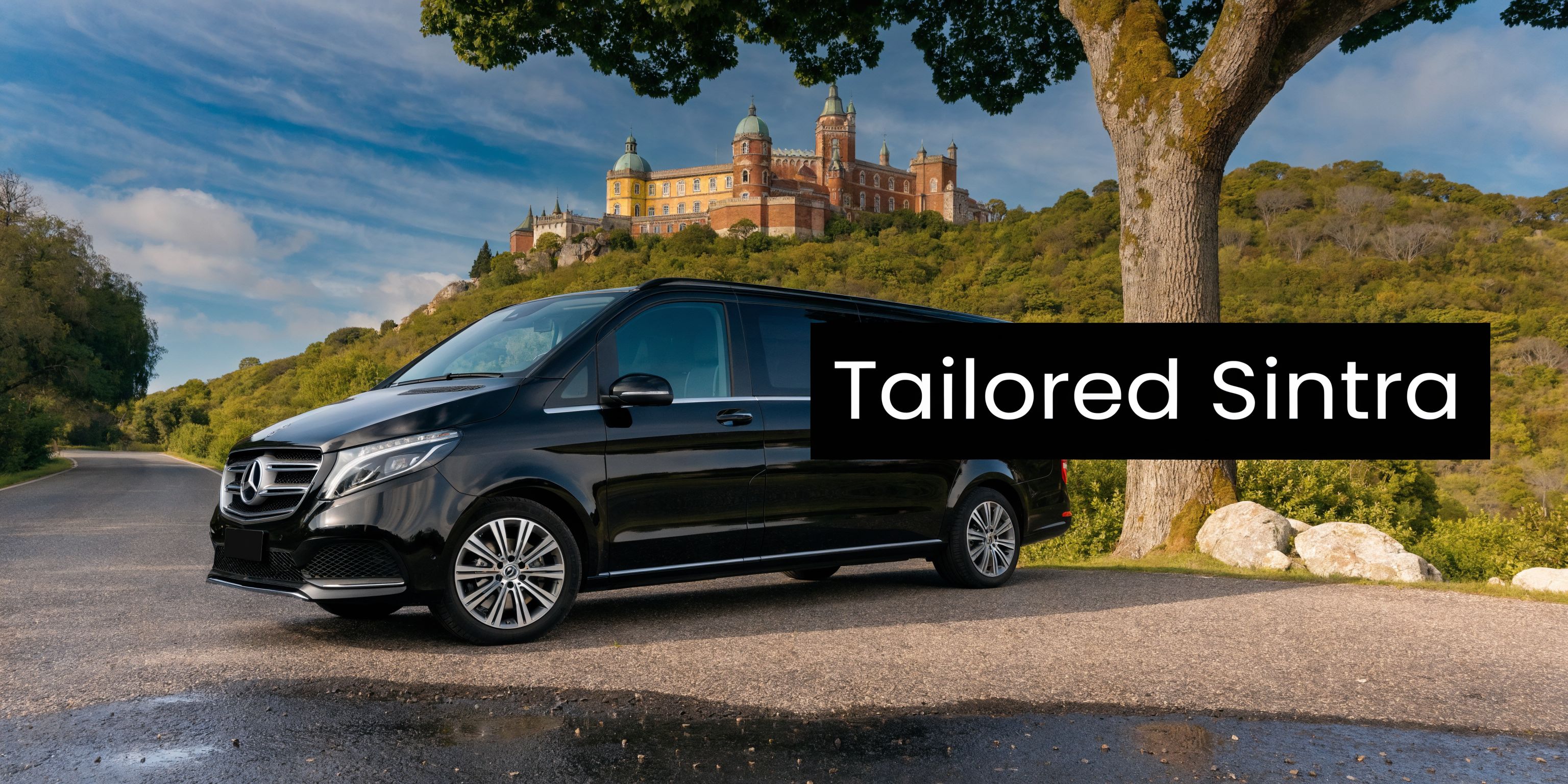 A black Mercedes-Benz luxury minivan parked on a scenic road near a historic castle in Sintra.