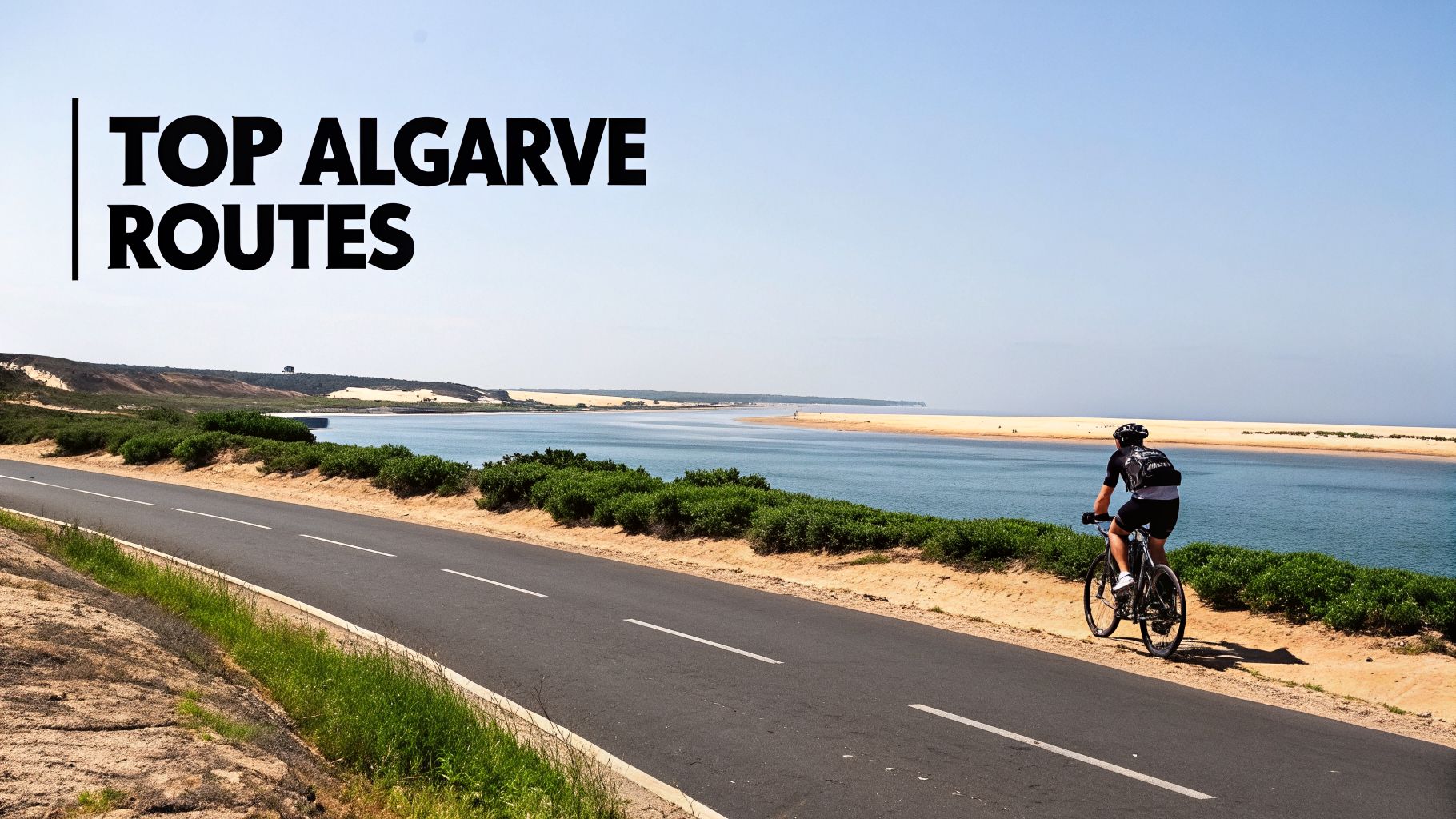 A cyclist rides along a scenic road next to a calm river and sandy banks in the Algarve, Portugal.