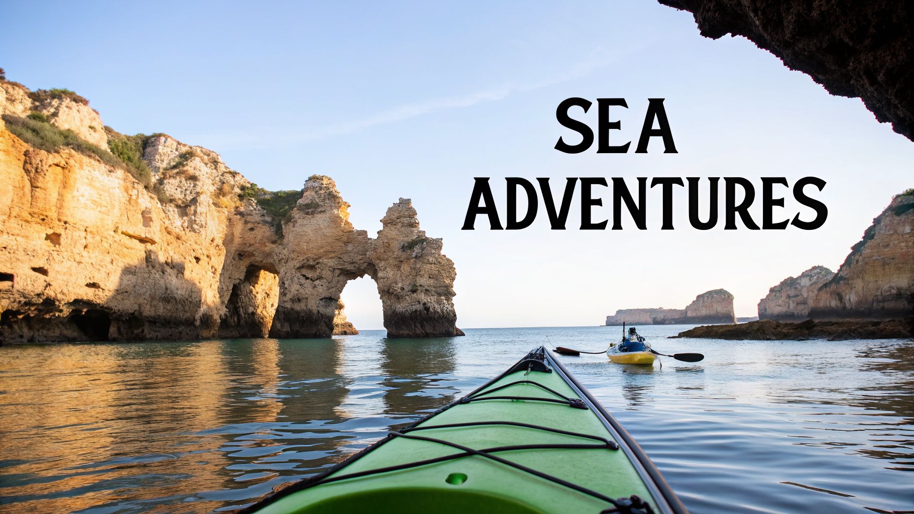 View from a green kayak exploring scenic sea caves and rock arches in the Algarve, Portugal.