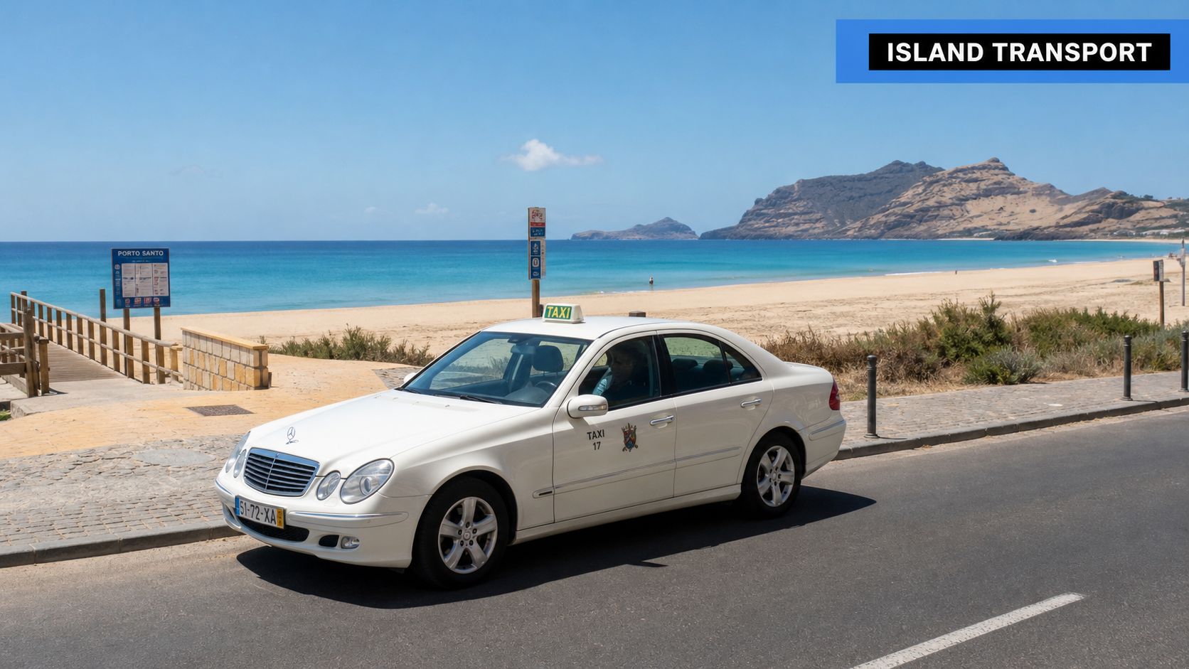 A white Mercedes taxi driving on a paved road next to a sandy beach in Porto Santo.