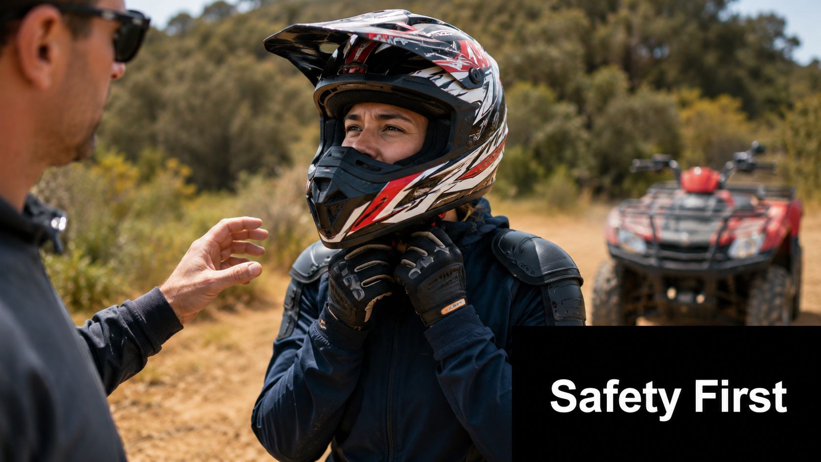 A male instructor helping a woman adjust her safety helmet before starting a quad bike tour.
