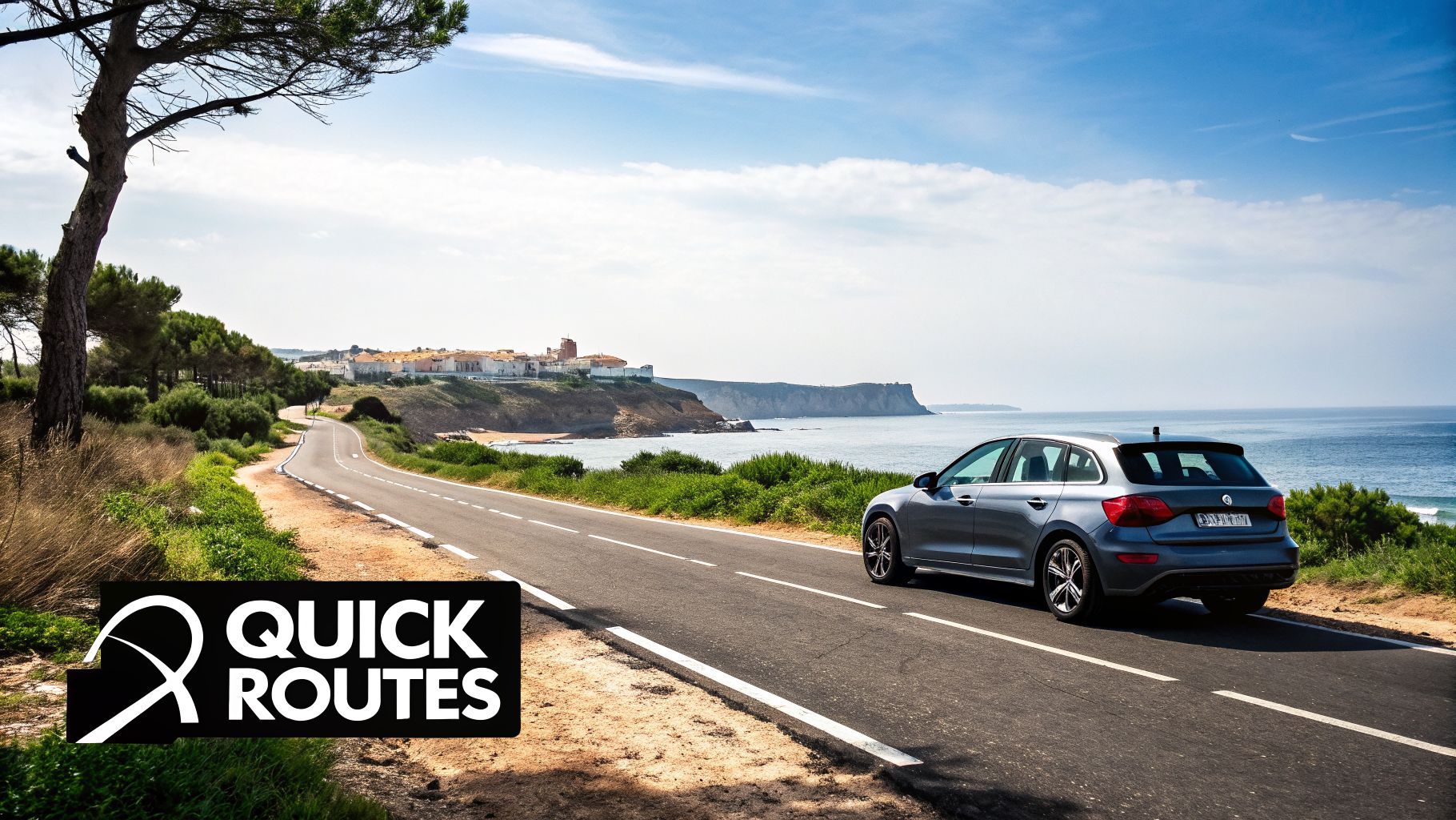 A blue car parked on a scenic coastal road overlooking a picturesque ocean and a village on a cliff.