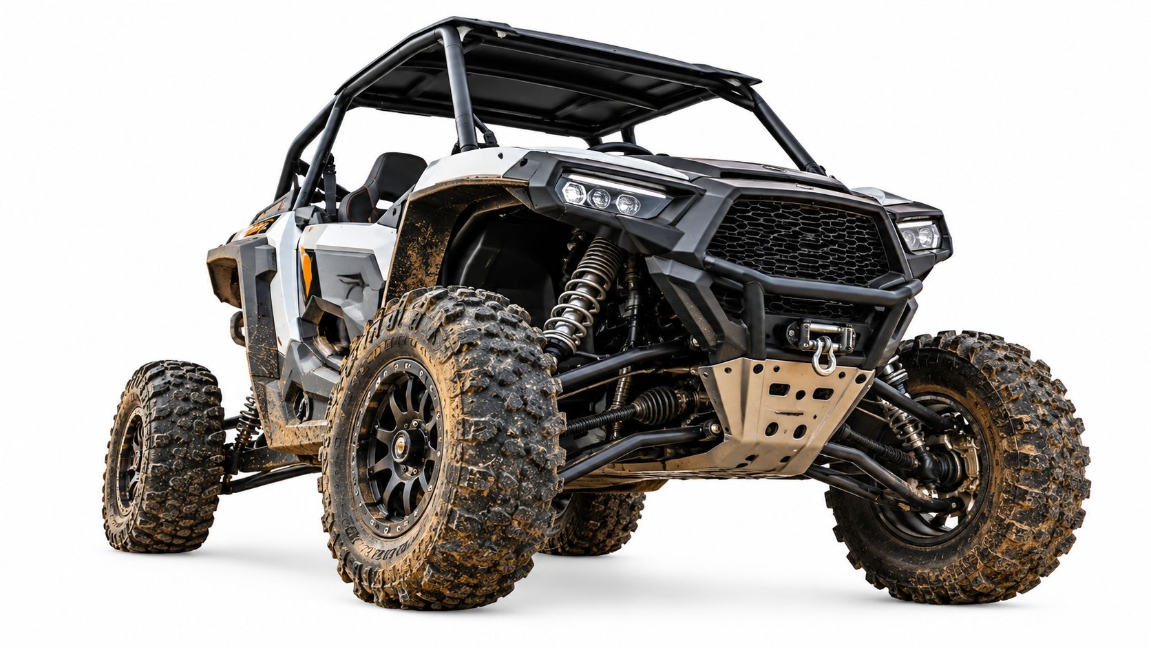 A dirty white and black off-road utility vehicle parked against a clean white studio background.