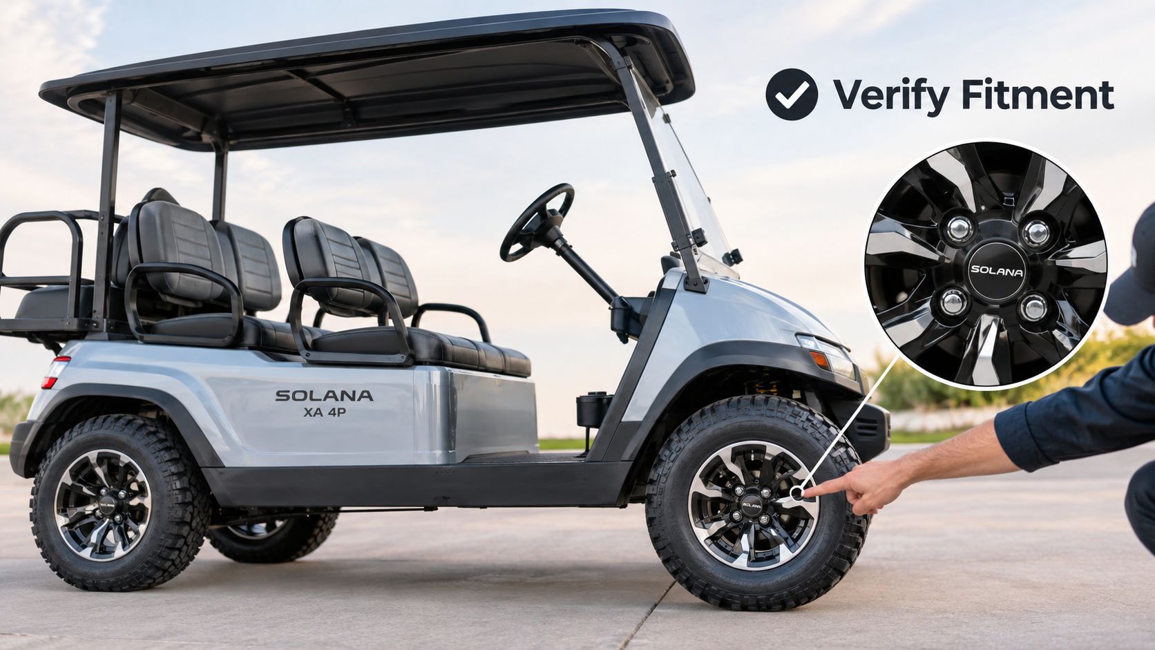 A person pointing to the lug nut on a grey Solana XA 4P golf cart wheel.
