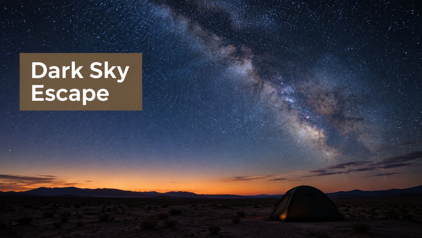 A luminous Milky Way galaxy shines brightly over a lone camping tent in a desert landscape.