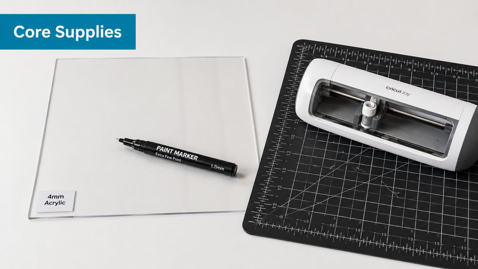 Core supplies for DIY acrylic wedding signs including a clear acrylic sheet, a marker, and a cutting machine.