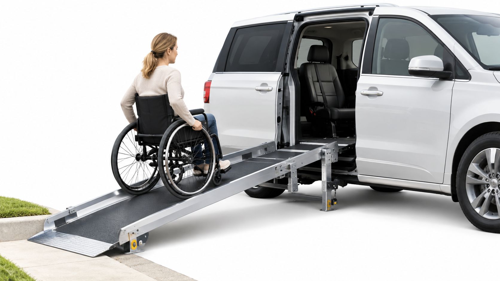 A woman in a manual wheelchair using a metal ramp to enter a side-entry accessible van.