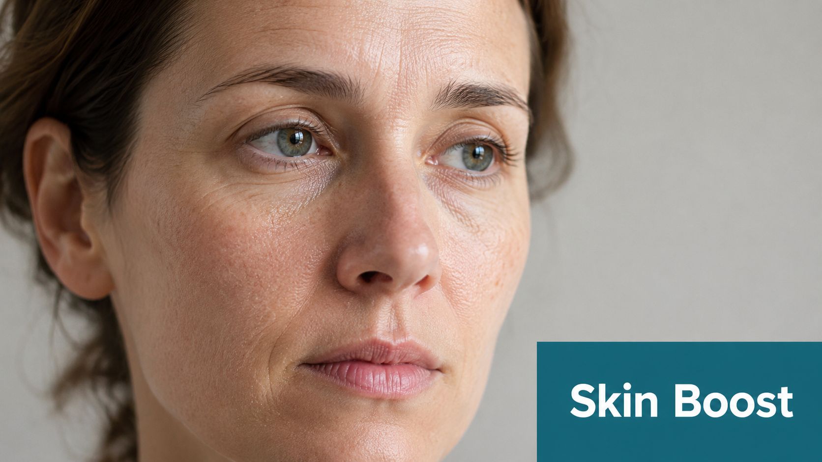 A close-up portrait of a woman with natural, mature skin texture, highlighting facial features and skincare concept.
