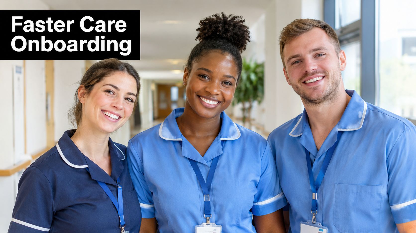 Three smiling healthcare workers in uniform standing together in a bright hospital corridor during staff onboarding.