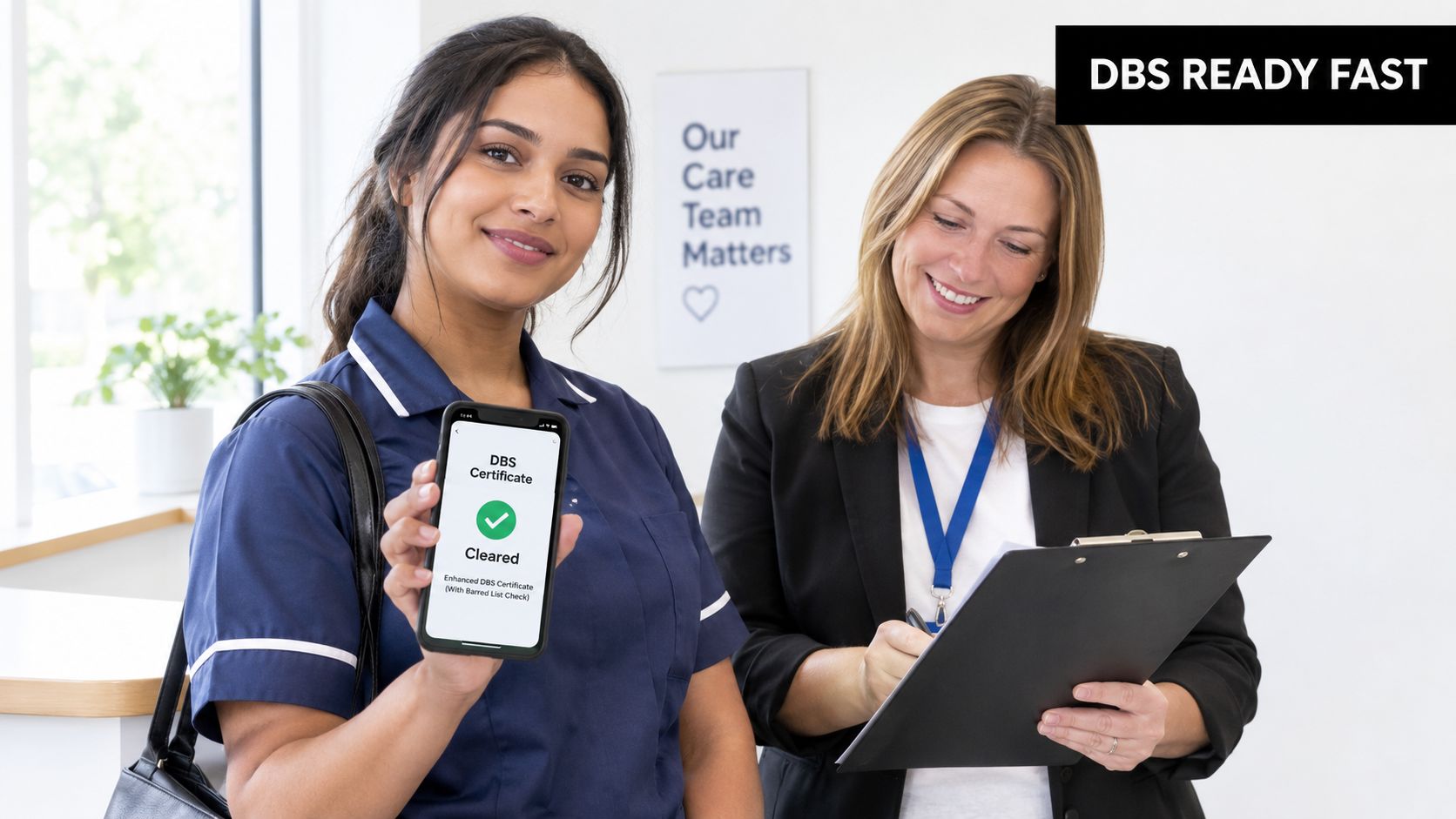 A healthcare worker showing her DBS clearance on a smartphone to an interviewer at an office.