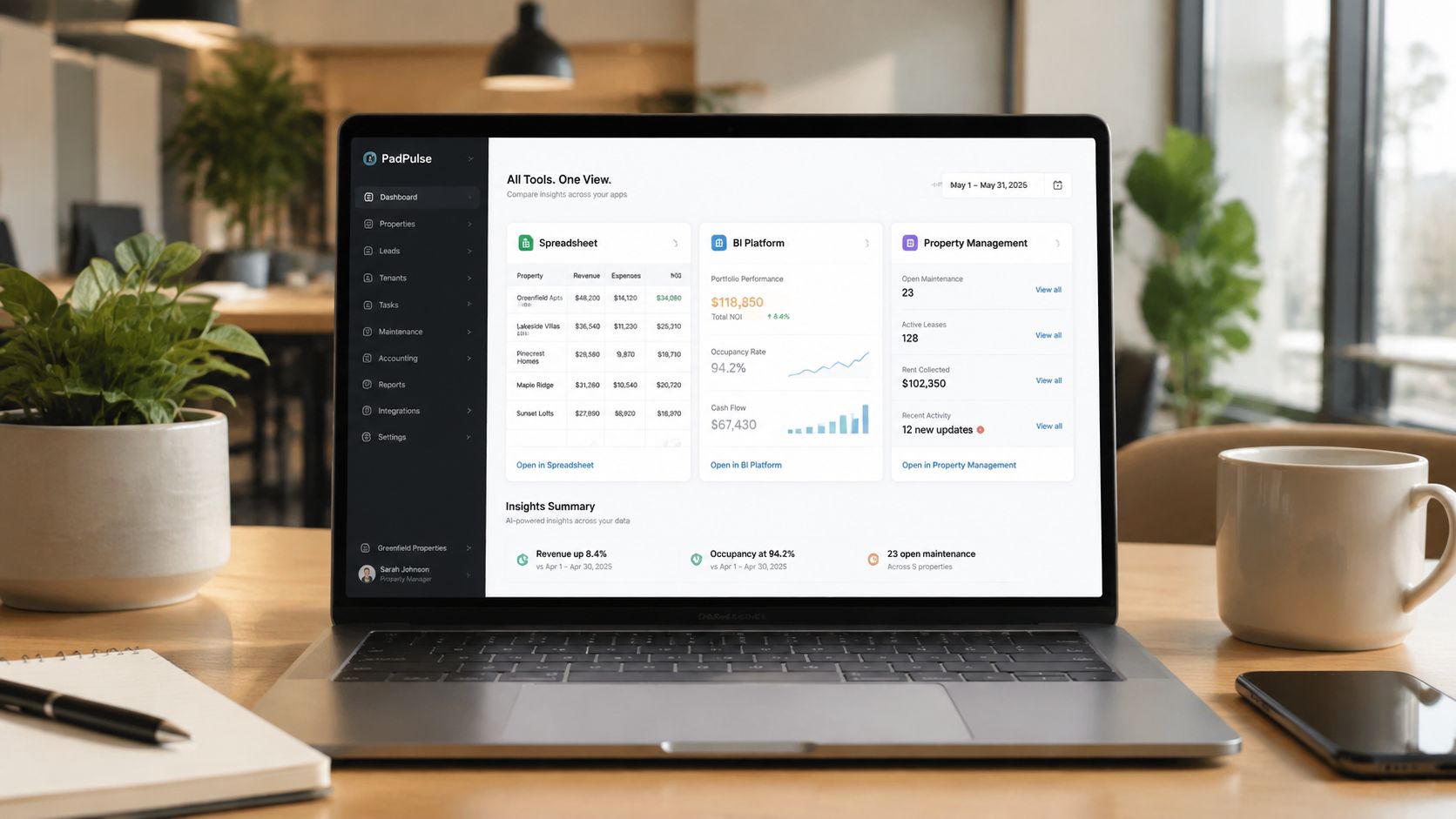 A laptop screen displaying a property management dashboard showing real estate analytics and financial data overview.