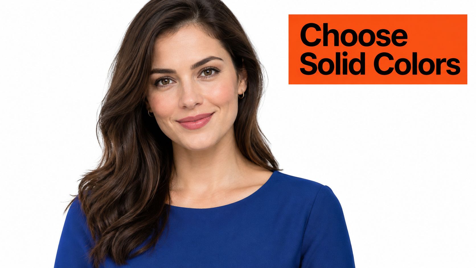 A professional portrait of a woman with long brown hair wearing a blue top against white background.