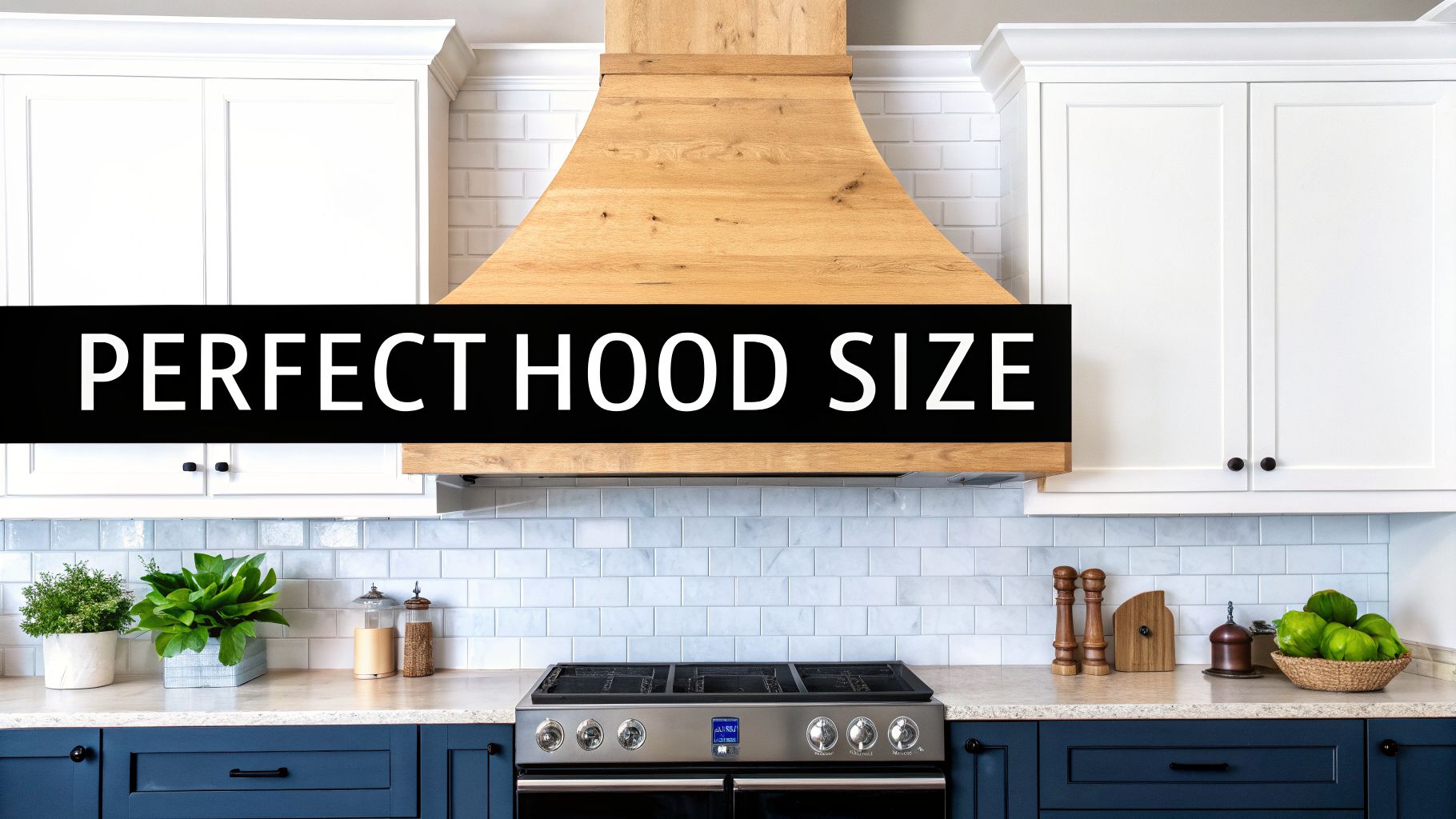A modern kitchen with a light wood range hood, white upper cabinets, and blue lower cabinets.