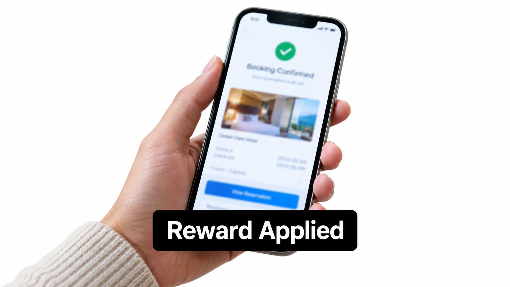 A person holding a smartphone displaying a successful hotel booking confirmation screen with a reward applied notice.