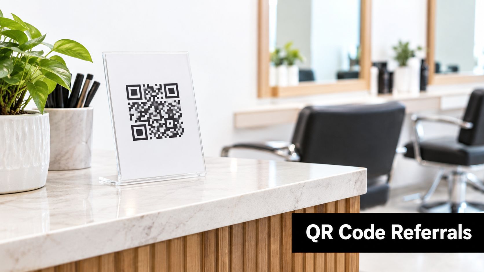 A salon front desk featuring a QR code sign to encourage customer referral program sign-ups.