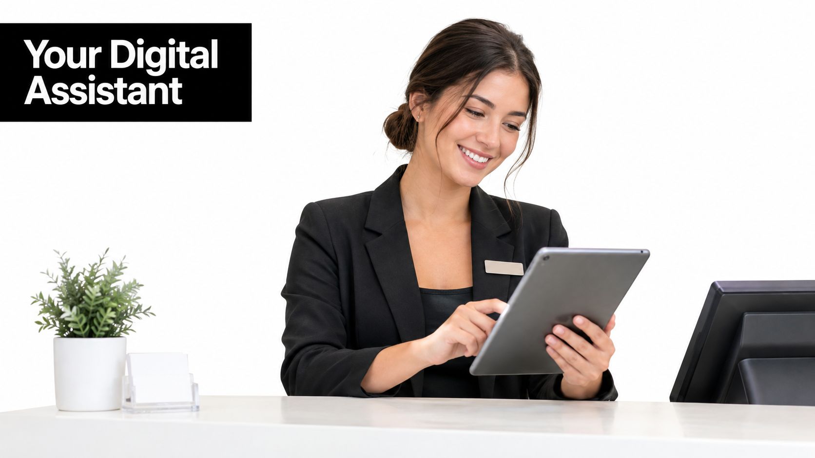 A smiling receptionist in a professional blazer using a digital tablet at an office front desk.