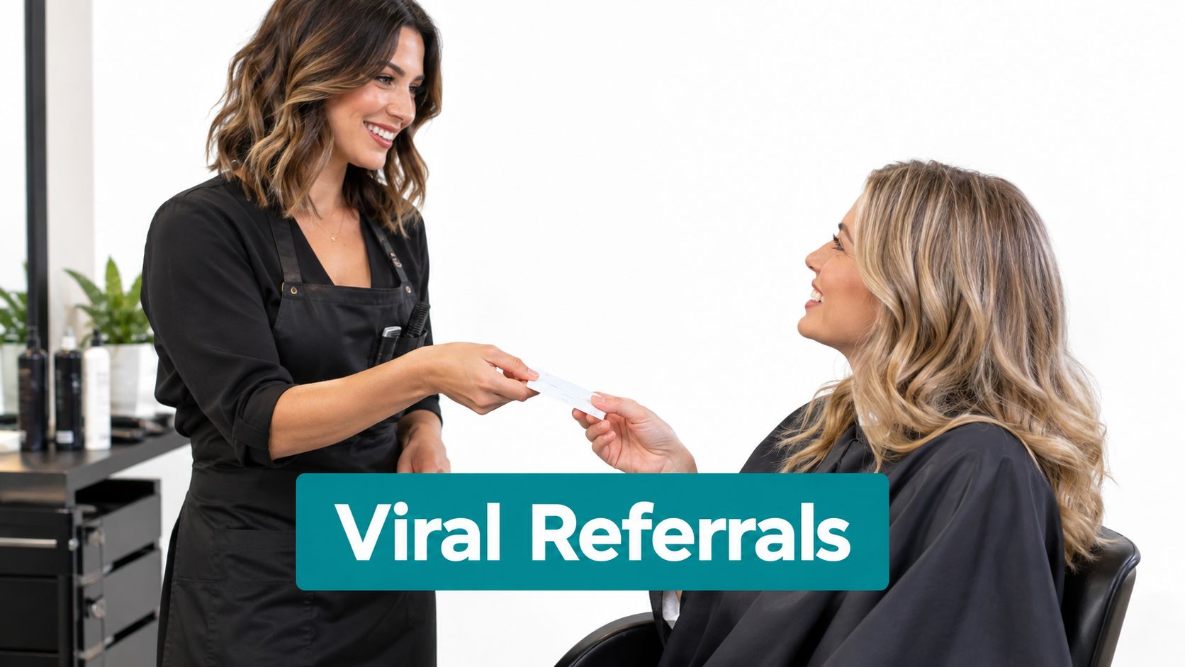 A professional hairstylist handing a gift card to her client in a modern hair salon studio.
