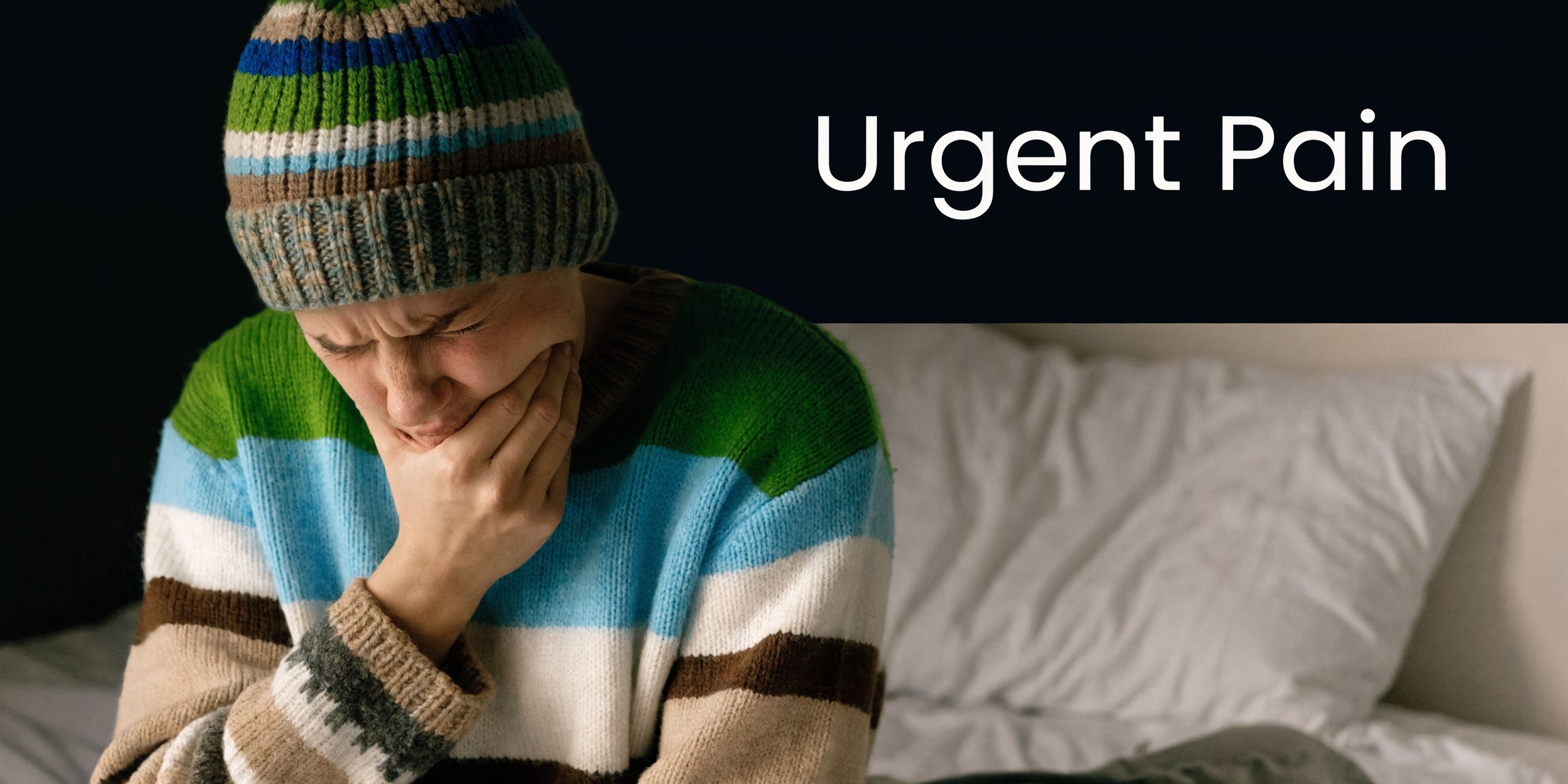 A person in a striped sweater and beanie holding their jaw in pain due to urgent dental discomfort.