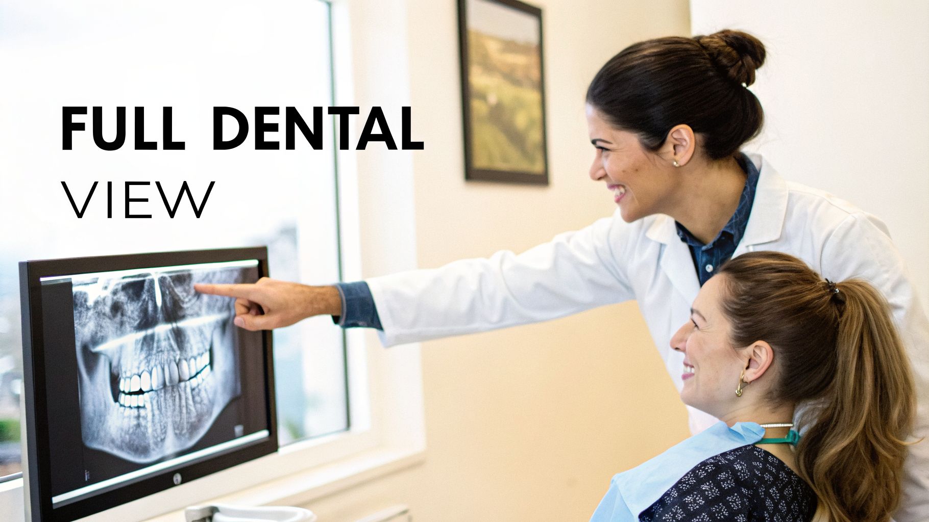 A smiling dentist and patient discuss a full dental panoramic X-ray on a monitor during a consultation.
