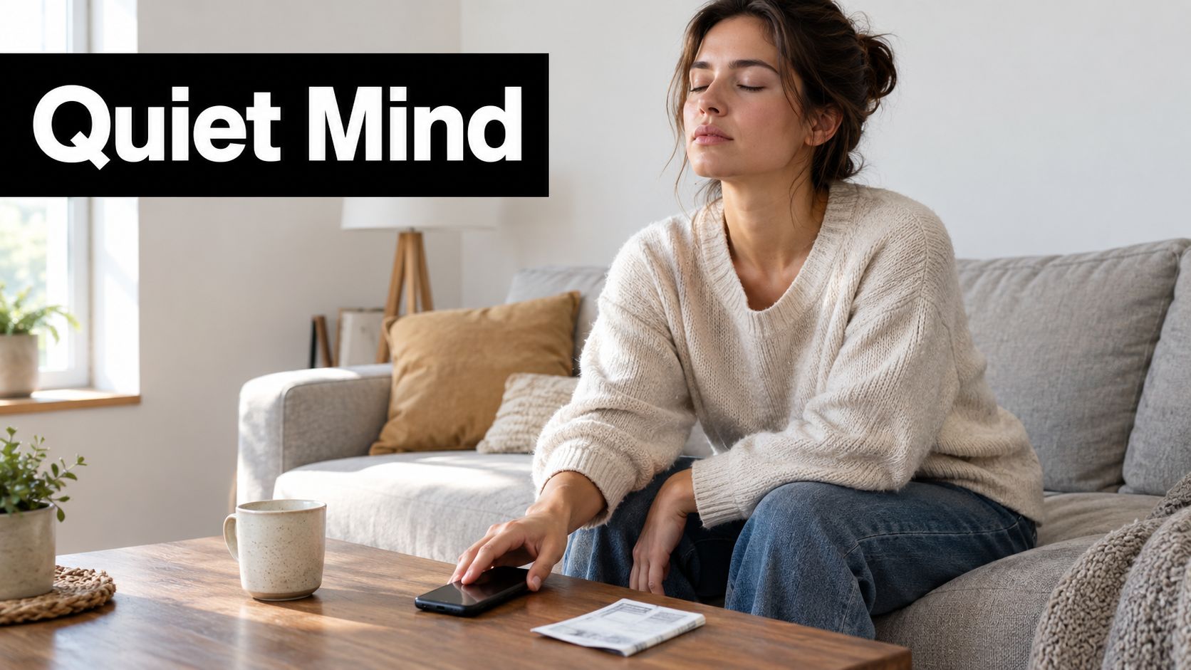 A relaxed woman sitting on a couch with her eyes closed, putting her smartphone down on a table.