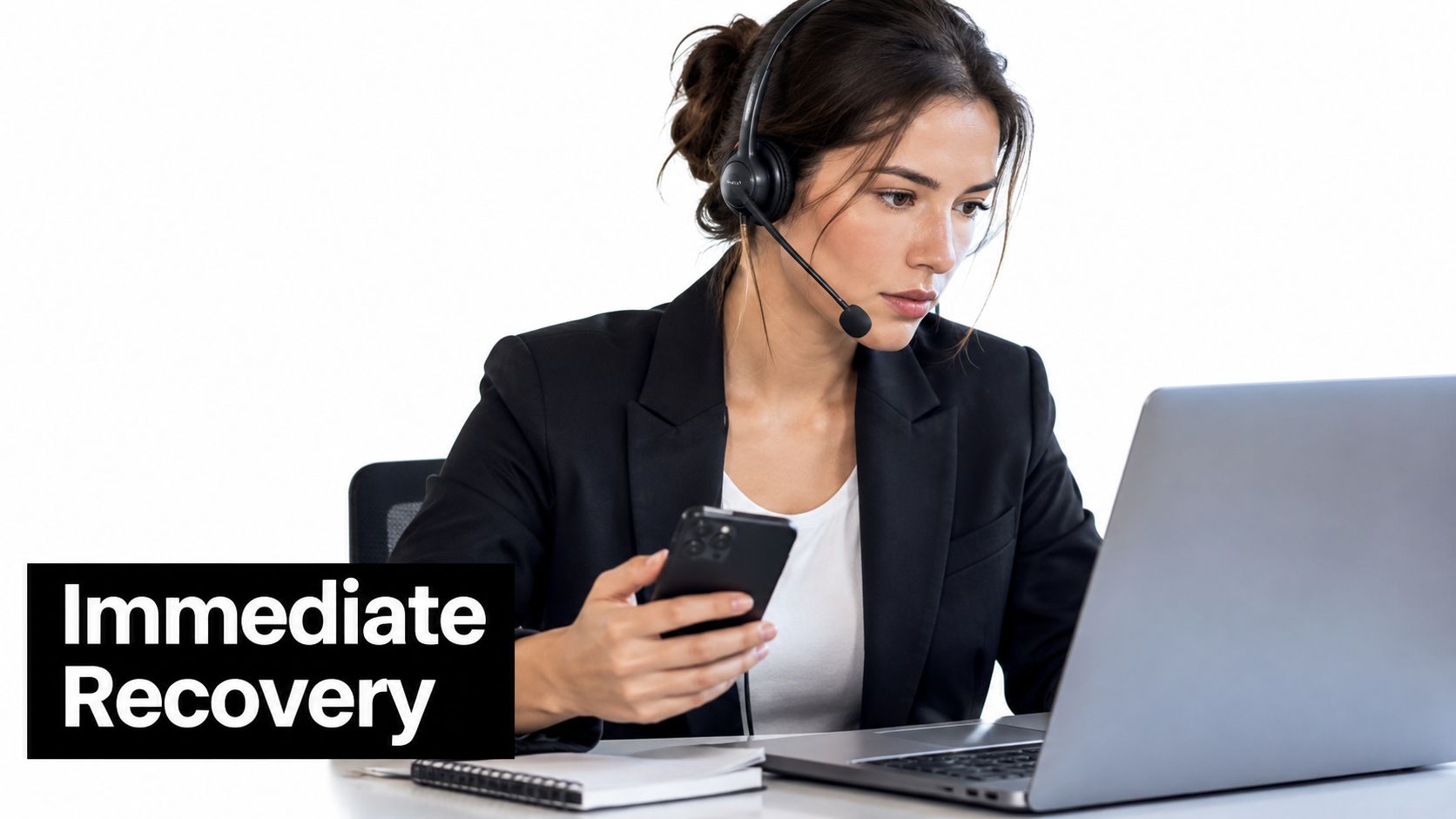 A professional travel logistics coordinator wearing a headset while using a laptop and mobile phone to work.