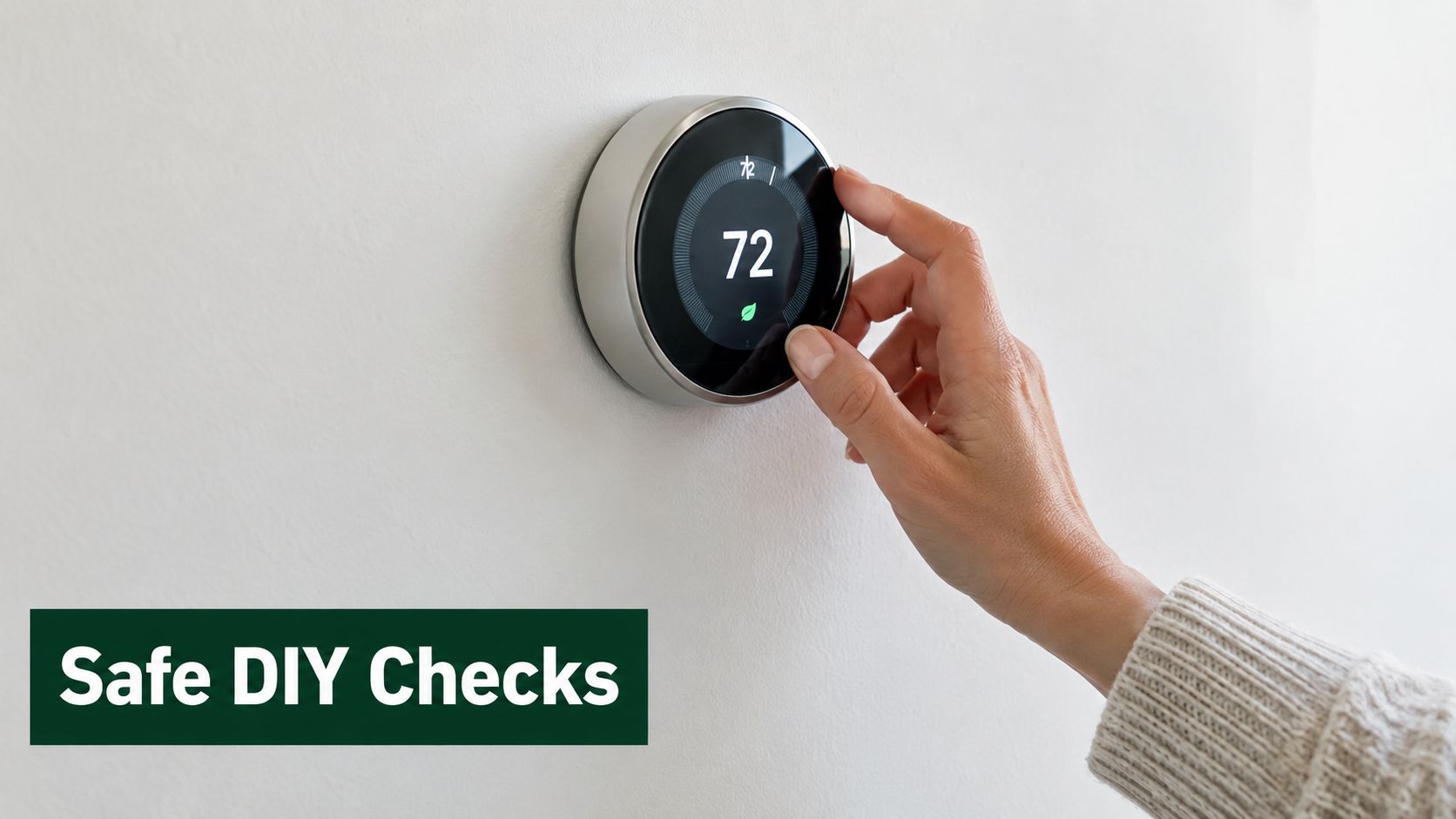 A hand adjusts the temperature on a round digital smart thermostat mounted on a white wall.