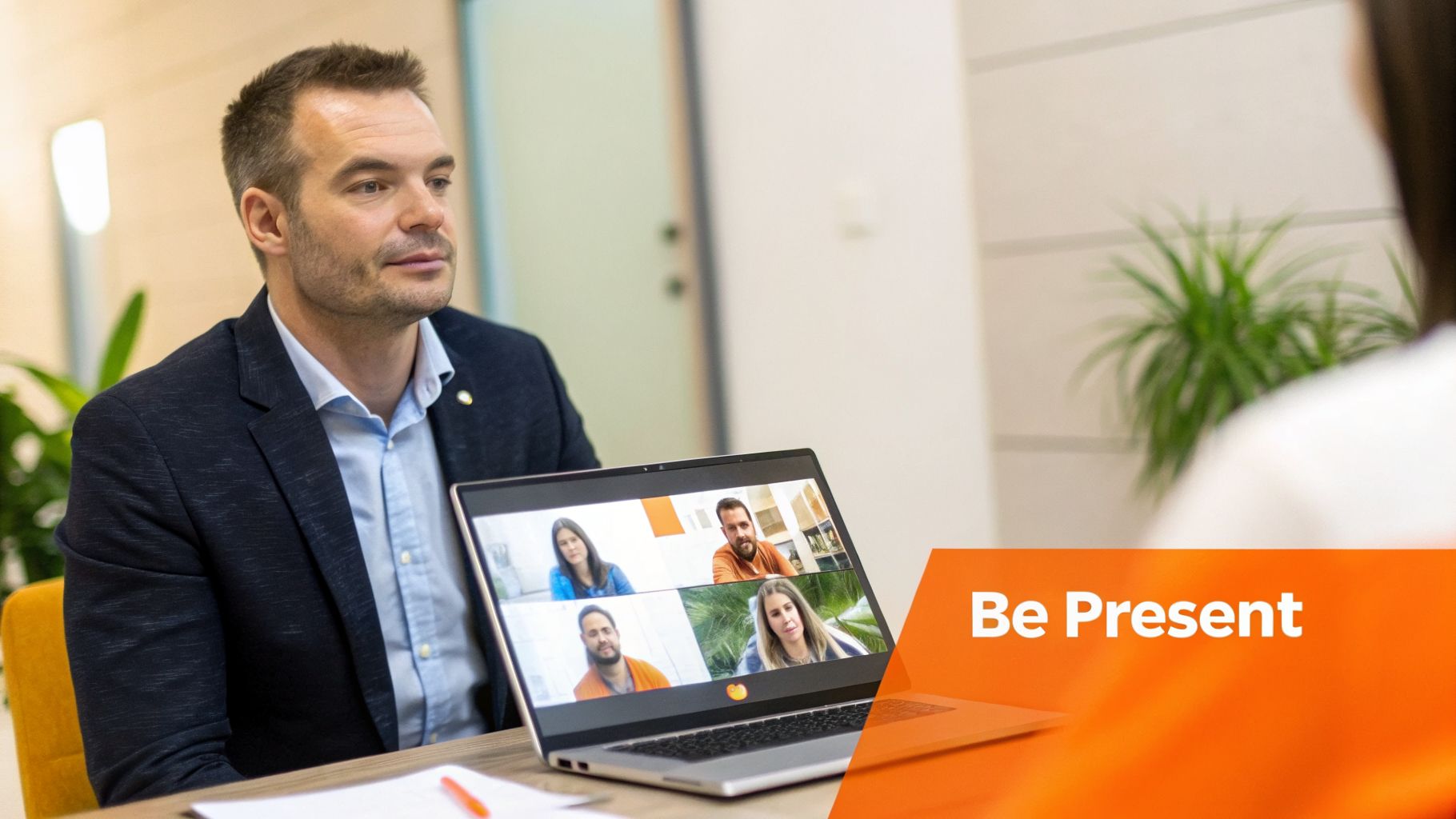 A man in a suit engages in a focused video call, with a 'Be Present' reminder.