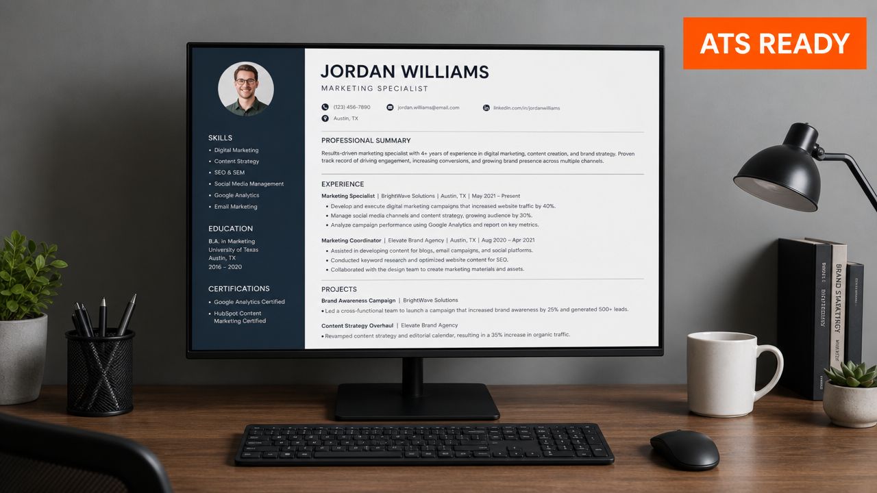 A professional resume for a marketing specialist displayed on a computer monitor on an office desk.