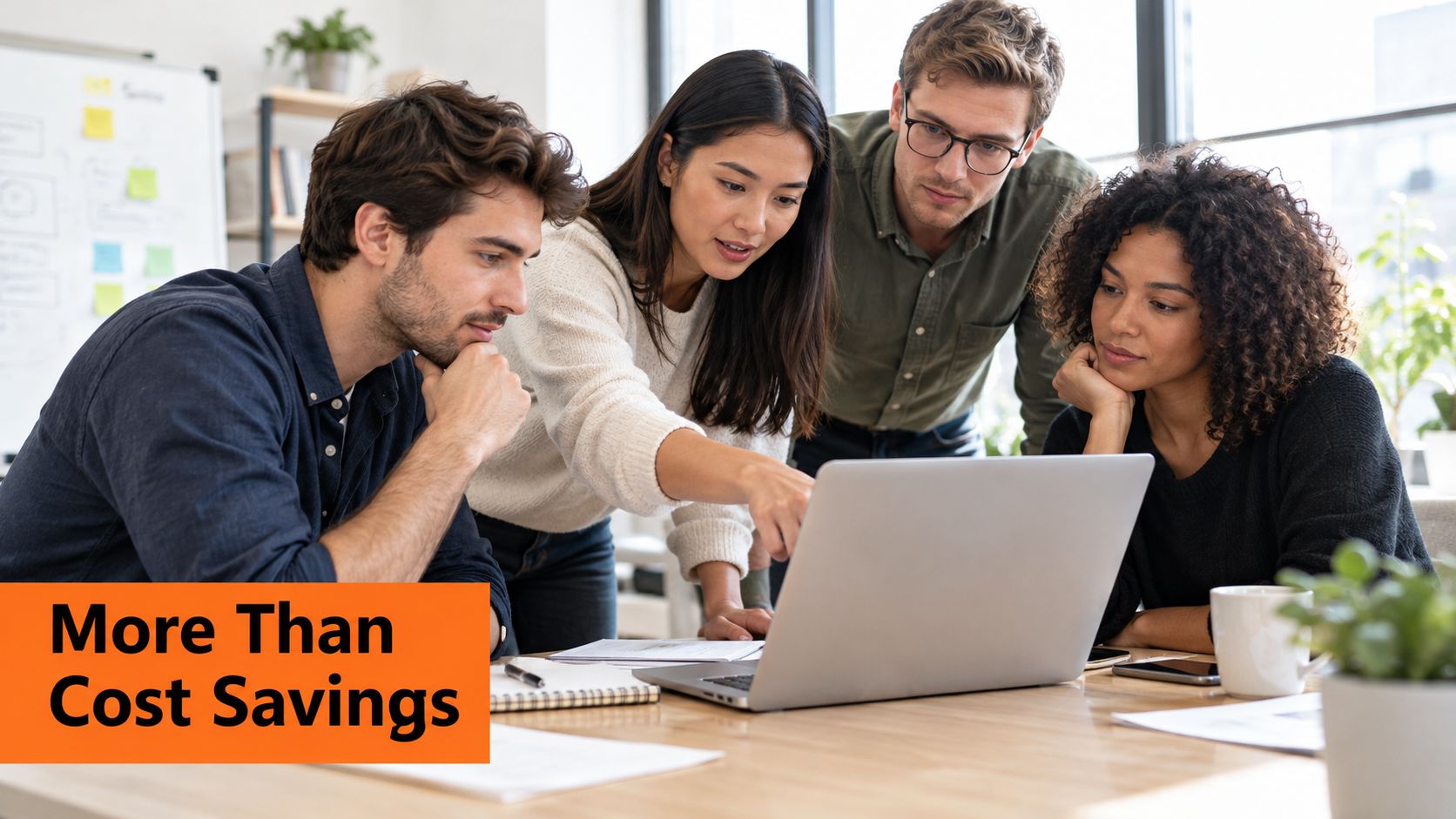 A diverse team of professionals collaborating around a laptop to discuss business growth and strategy.