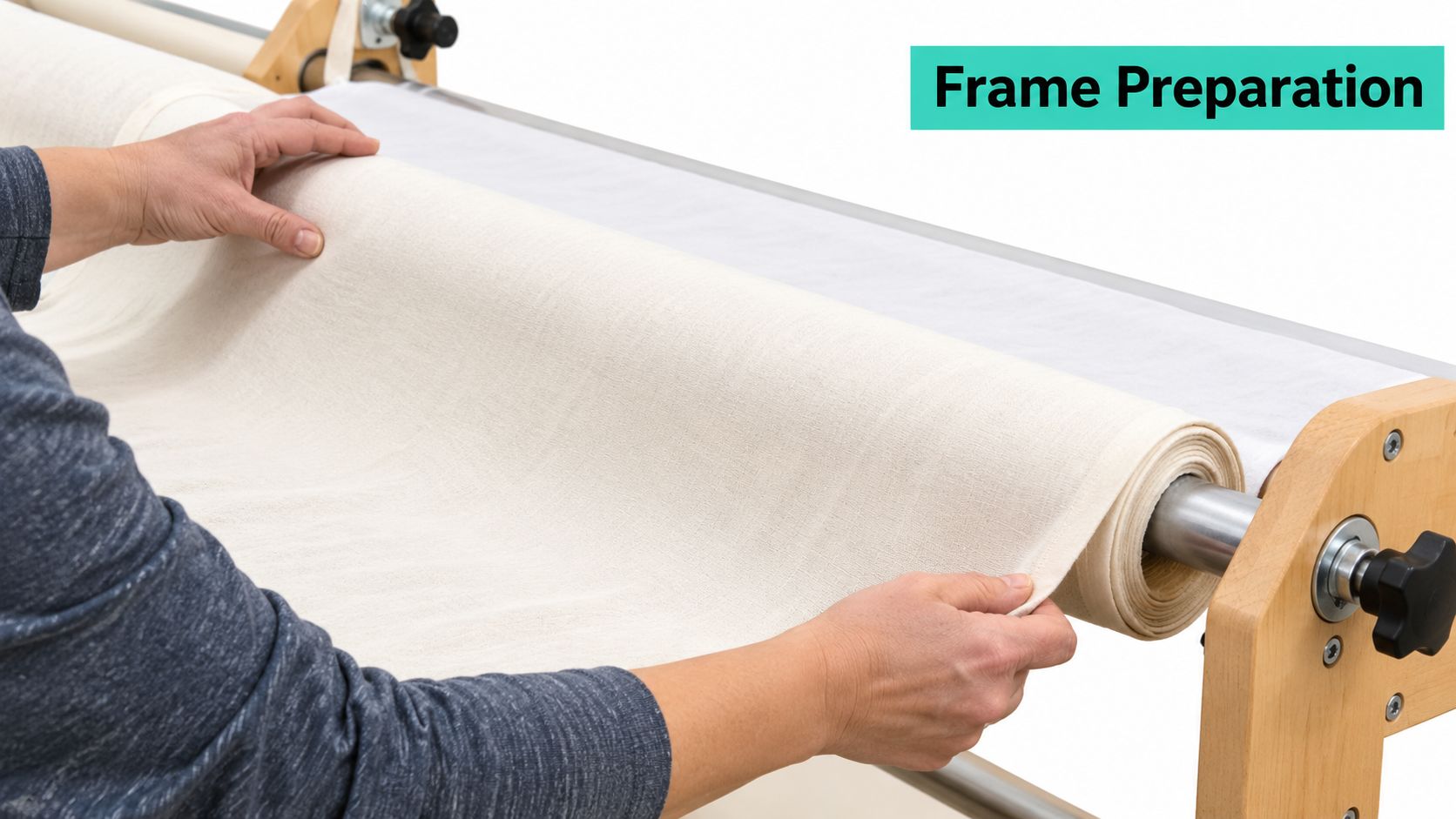 A person carefully aligning a piece of fabric onto a long arm quilting machine wooden frame.