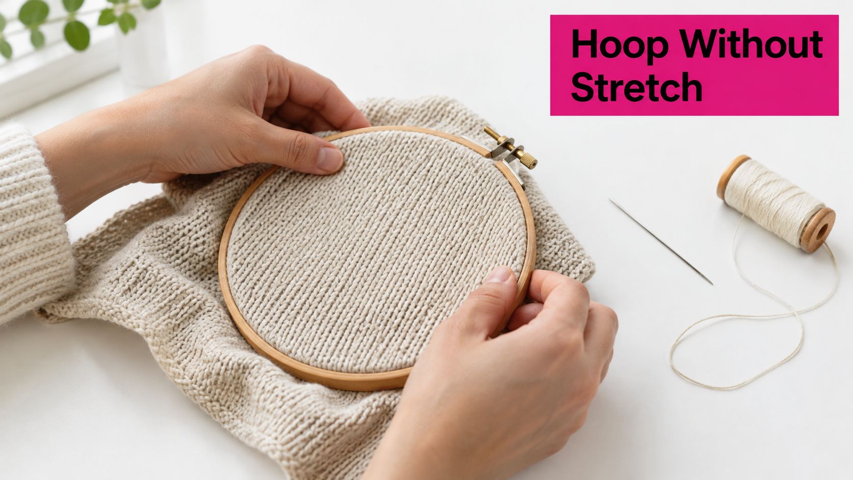 A pair of hands gently positioning a knitted fabric within a wooden embroidery hoop for crafting.