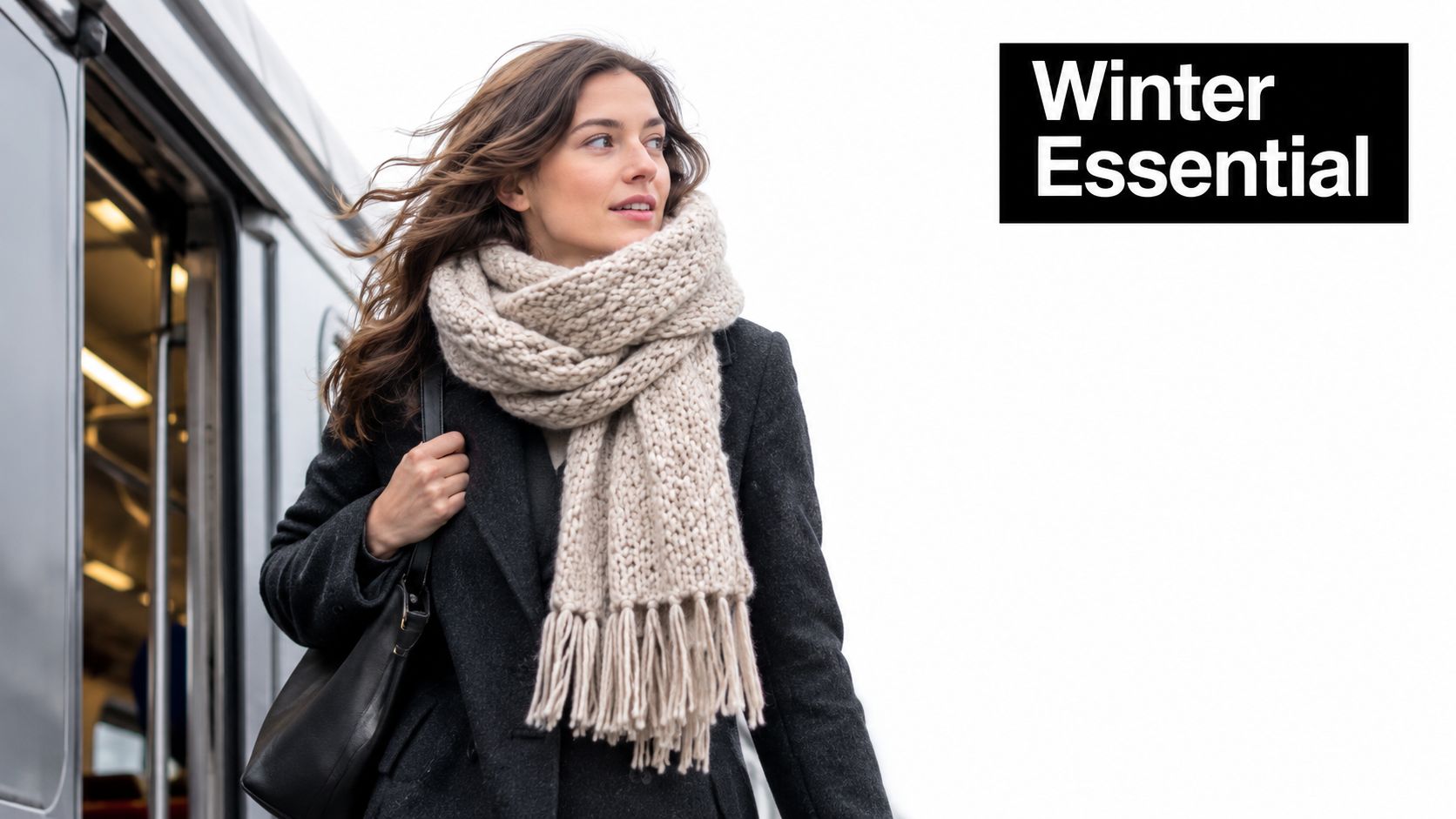 A stylish woman wearing a thick beige knit scarf and a dark coat stepping off a train.