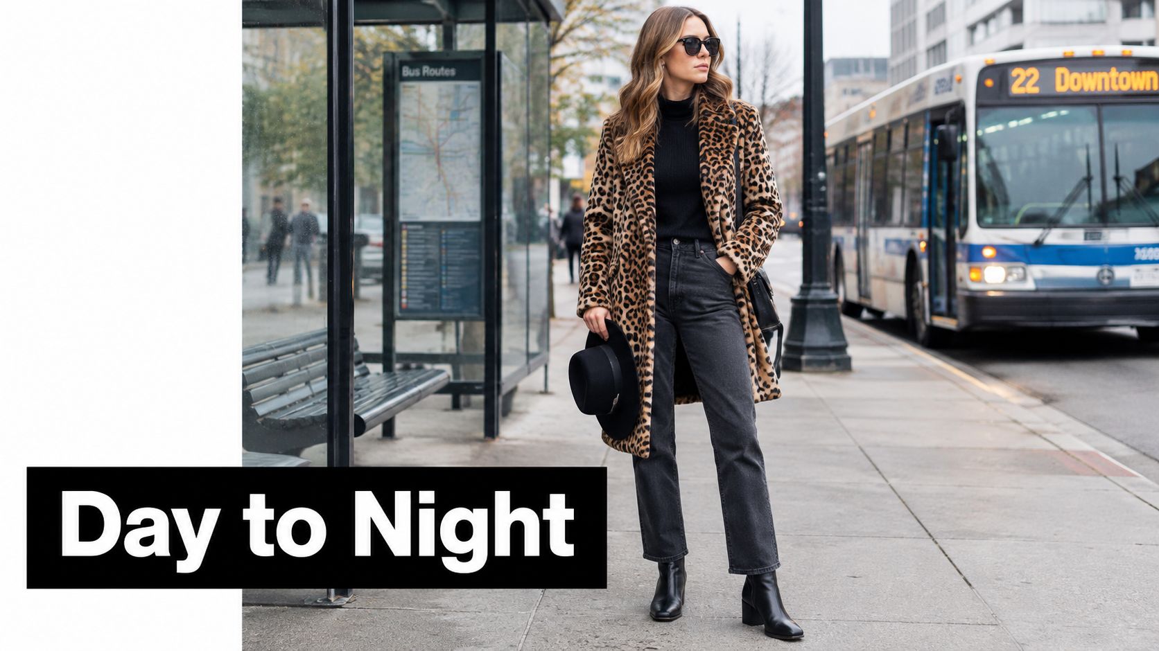 A stylish woman wearing a cheetah print coat walks down a city sidewalk near a bus stop.