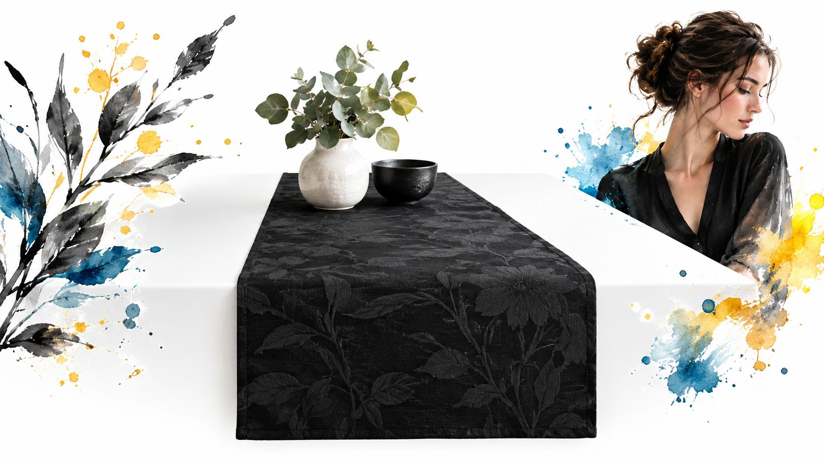 A black tone on tone fabric table runner displays floral patterns next to a vase and bowl.